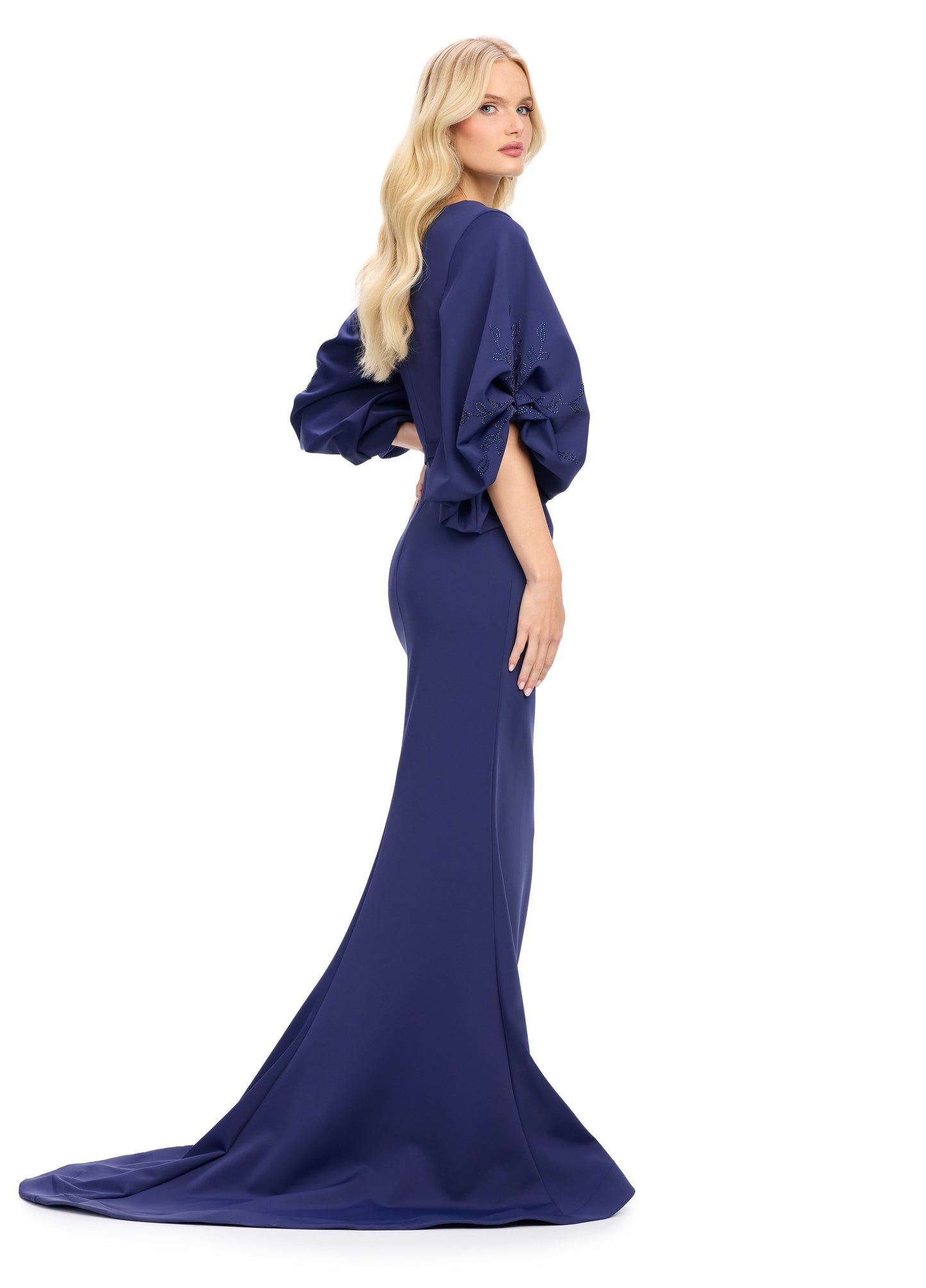 Elevate your evening look with the stunning Ashley Lauren 11740 Long Gathered Sleeves Evening Gown. The scuba fabric provides a sleek and comfortable fit, while the belted waistline accentuates your figure. The gathered sleeves add an elegant touch to this chic gown, making it perfect for any special occasion.