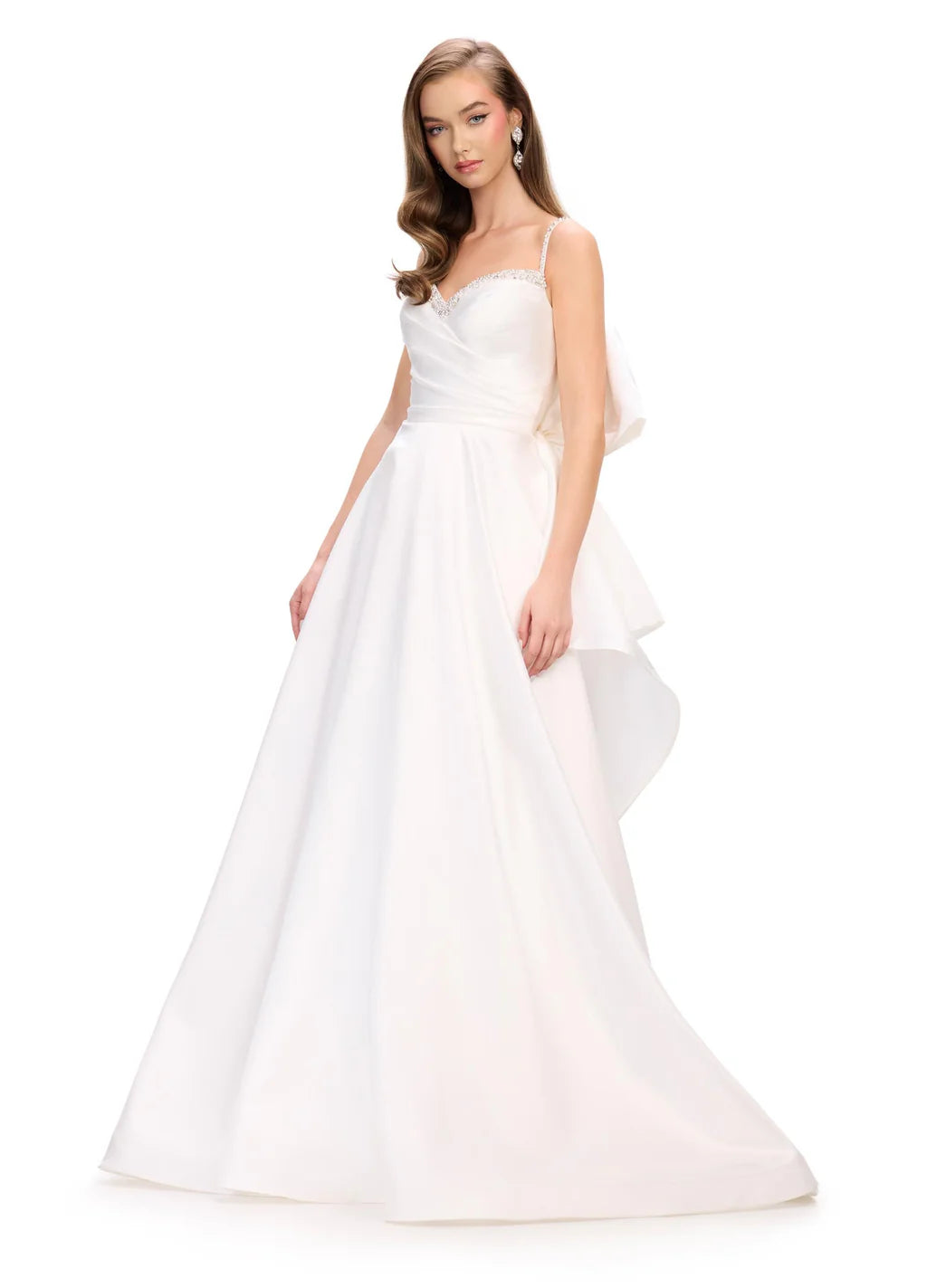 Elevate your evening look with the Ashley Lauren 11769 Satin Ballgown. This stunning and sophisticated gown features a sweetheart neckline, ruched bodice, and a full skirt with a train. The satin fabric adds a luxurious touch, while the bow detail adds a feminine and elegant touch. Perfect for any formal occasion.