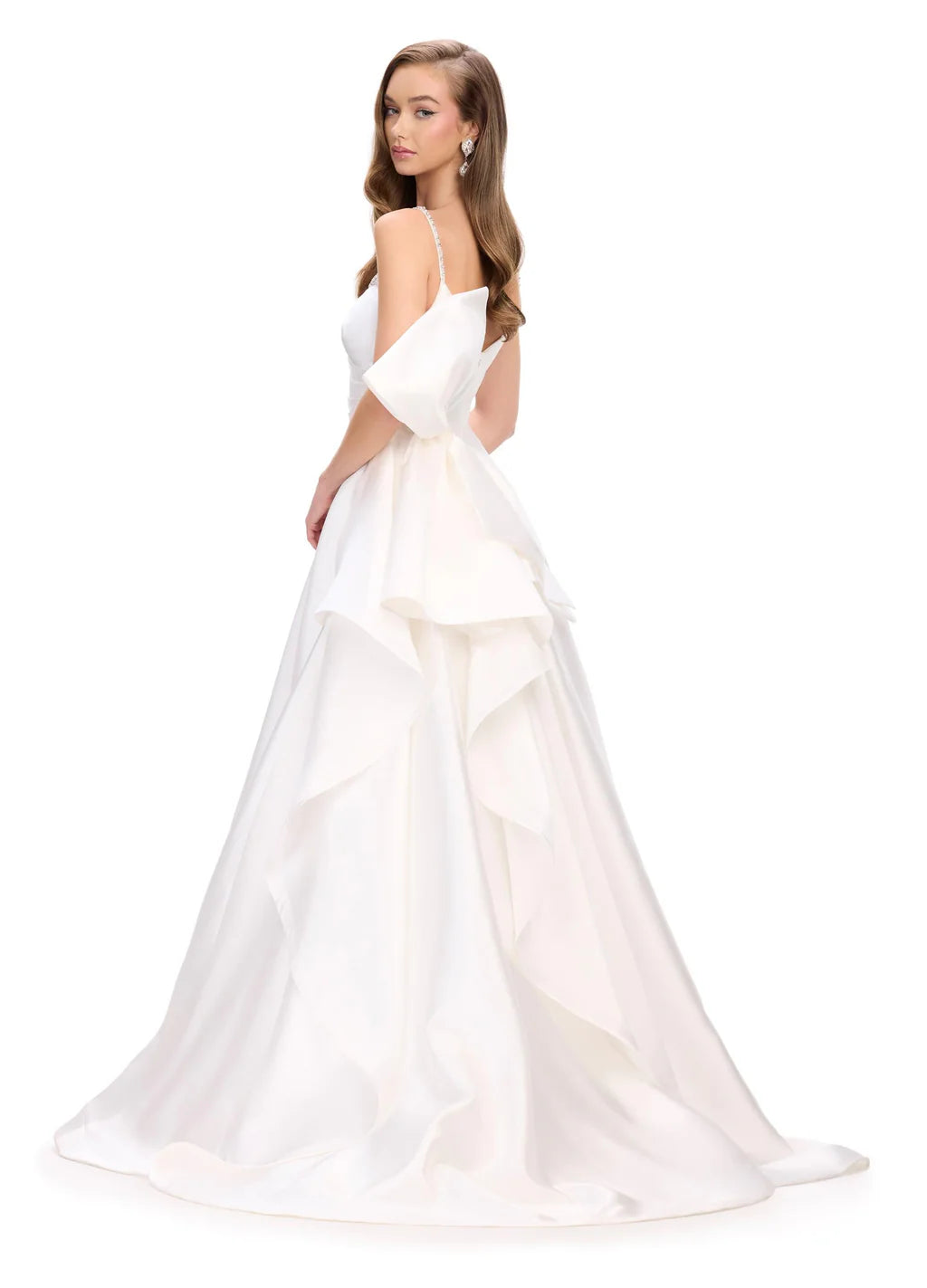 Elevate your evening look with the Ashley Lauren 11769 Satin Ballgown. This stunning and sophisticated gown features a sweetheart neckline, ruched bodice, and a full skirt with a train. The satin fabric adds a luxurious touch, while the bow detail adds a feminine and elegant touch. Perfect for any formal occasion.