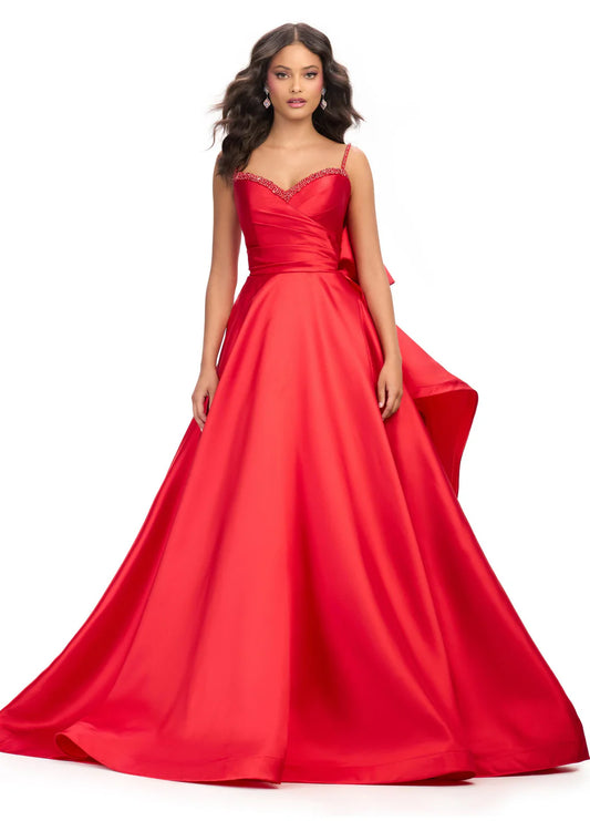 Elevate your evening look with the Ashley Lauren 11769 Satin Ballgown. This stunning and sophisticated gown features a sweetheart neckline, ruched bodice, and a full skirt with a train. The satin fabric adds a luxurious touch, while the bow detail adds a feminine and elegant touch. Perfect for any formal occasion.