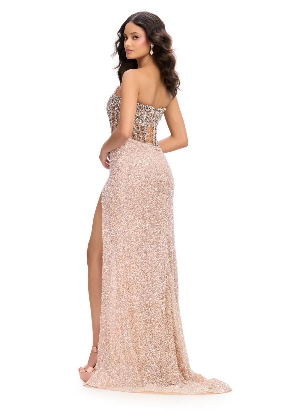 The Ashley Lauren 11830 Prom Dress is a stunning choice for any formal occasion. Adorned with sequins and sheer crystal detailing, this strapless corset gown exudes elegance and luxury. The slit adds a touch of allure while the corset provides a flawless fit. Perfect for making a statement on any red carpet event or pageant stage