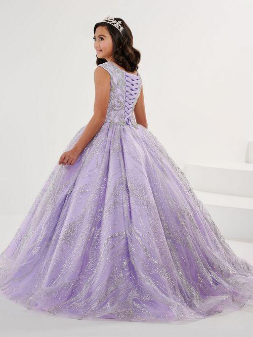 The Tiffany Princess 13575 Pageant Dress is the epitome of elegance. Featuring a high neck and crystal embellishments, this A-line gown exudes sophistication and grace. Made with sparkling glitter and quality materials, it will make any young girl feel like royalty. Perfect for pageants or any formal event.&nbsp;