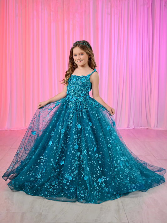 Dress your little princess like royalty with our Tiffany Princess 13758 Long Lace Pageant Dress. The stunning scoop neckline and spaghetti straps enhance a regal look. Adorned with 3D floral and glitter details, the tulle ball gown skirt adds a touch of elegance. The lace-up back and sweep train complete the fairytale feel of this dress.