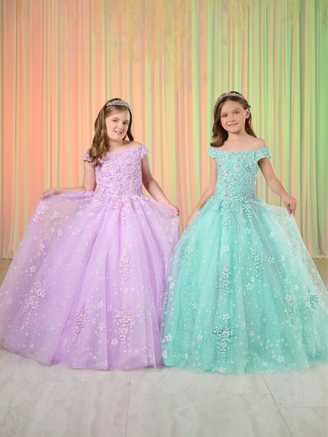 This beautiful Tiffany Princess pageant dress features shimmering lace, off the shoulder design, and a corset-style bodice. Perfect for formal occasions, this gown is sure to make your little girl feel like a princess. The stylish and comfortable design will have her shining on stage.