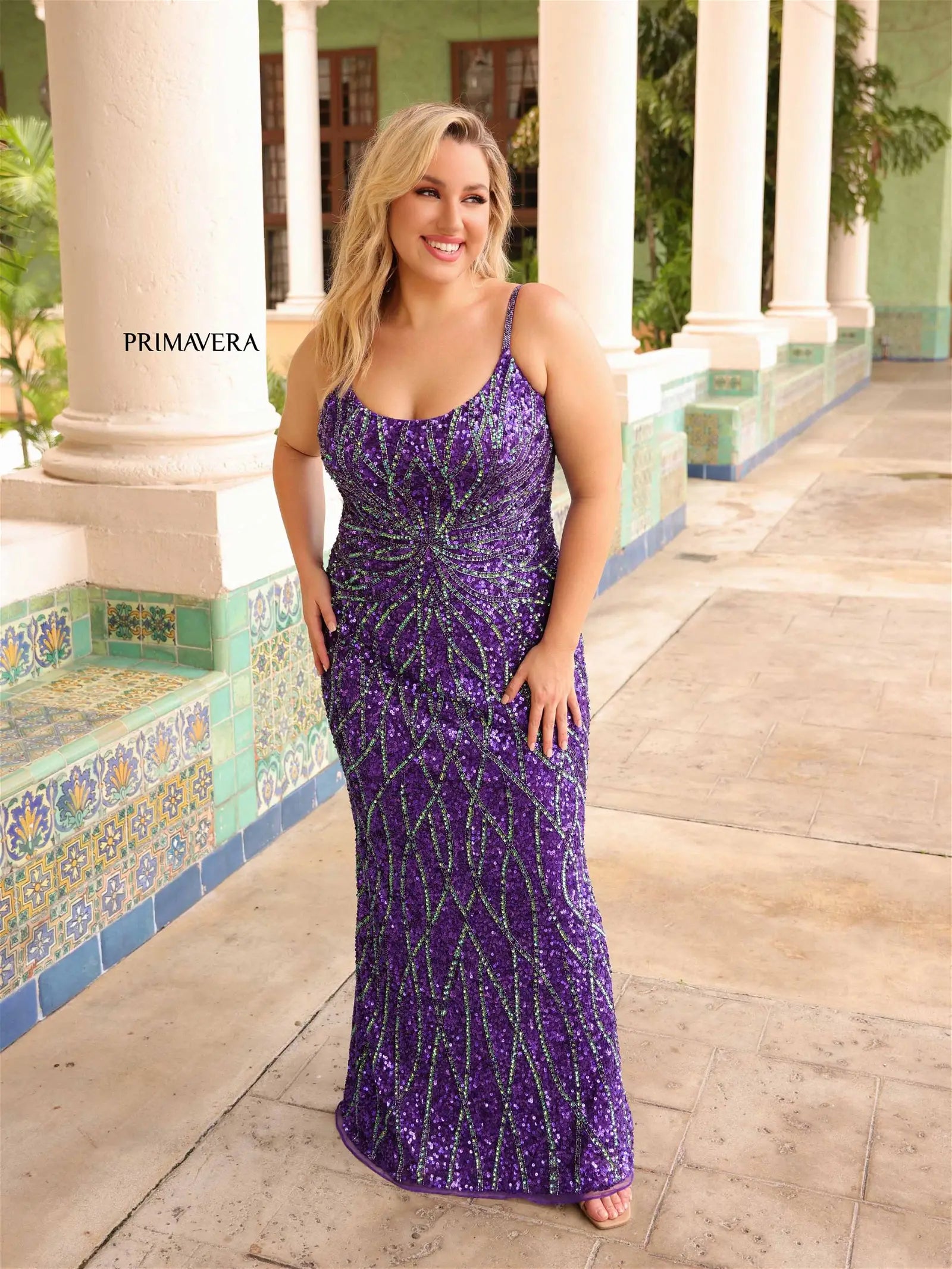 Make a statement in Primavera Couture 14045 Plus Size Sequin Prom Dress. Sequin detailing and corset back create a stunning silhouette and ensures a flattering fit. Scoop neckline and no-slit skirt make this dress the perfect choice for your special occasion.  Sizes: 14W-24W  Colors: Purple, Fuchsia, Nude/Gold