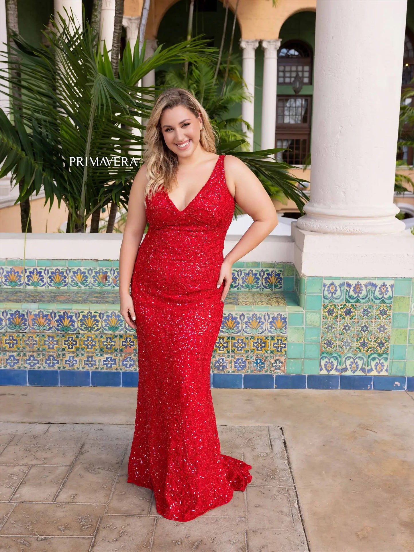 Get ready to dazzle in style with the Primavera Couture 14048 Long Prom Dress. This stunning plus size gown features a fitted sequin design on a V-neckline, perfect for any formal occasion. Make a statement and stand out from the crowd in this glamorous and figure-flattering dress.