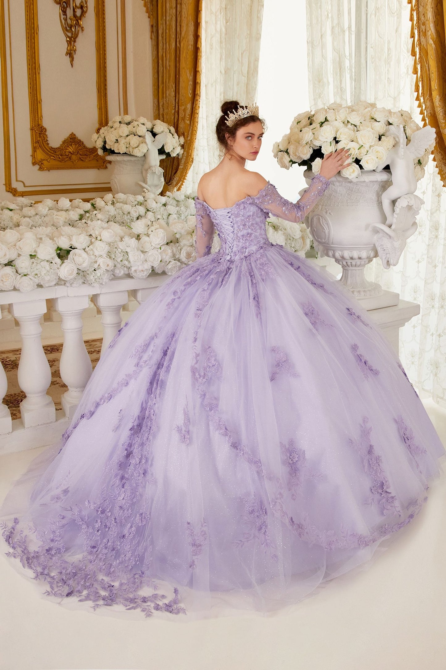 This Ladivine 15706 dress will have you feeling like royalty! The off-the-shoulder style and lacy corset make it perfect for your quinceanera or special event. Get ready for the night of a lifetime in this absolutely stunning ballgown! Imagine looking like royalty on your special day. This gorgeous off-the-shoulder, long-sleeved ball gown is an enchanting piece of work that will make you look like a quinceanera princess! The crafted lace and beaded applique add the perfect amount of shine to the bodice. 