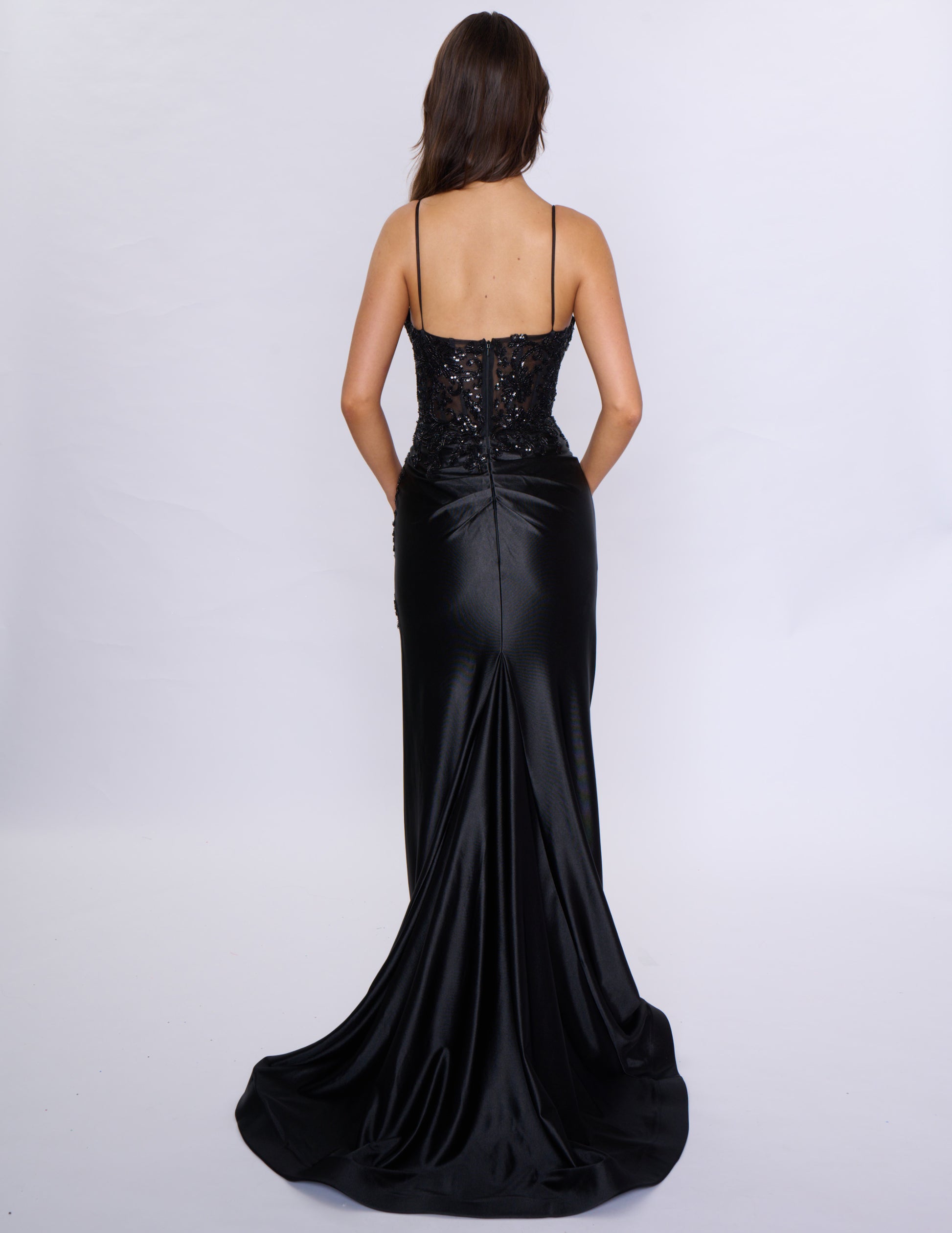 Look stunning at prom or any formal event with the Nina Canacci 1585 Fitted Sequin Long Prom Dress. This figure-hugging gown features a flattering ruched V-neckline and a daring thigh-high slit. The sequin fabric adds a touch of glamour and the long length will make you stand out.

Sizes: 0-14

Colors: Black, Emerald, Rose Gold