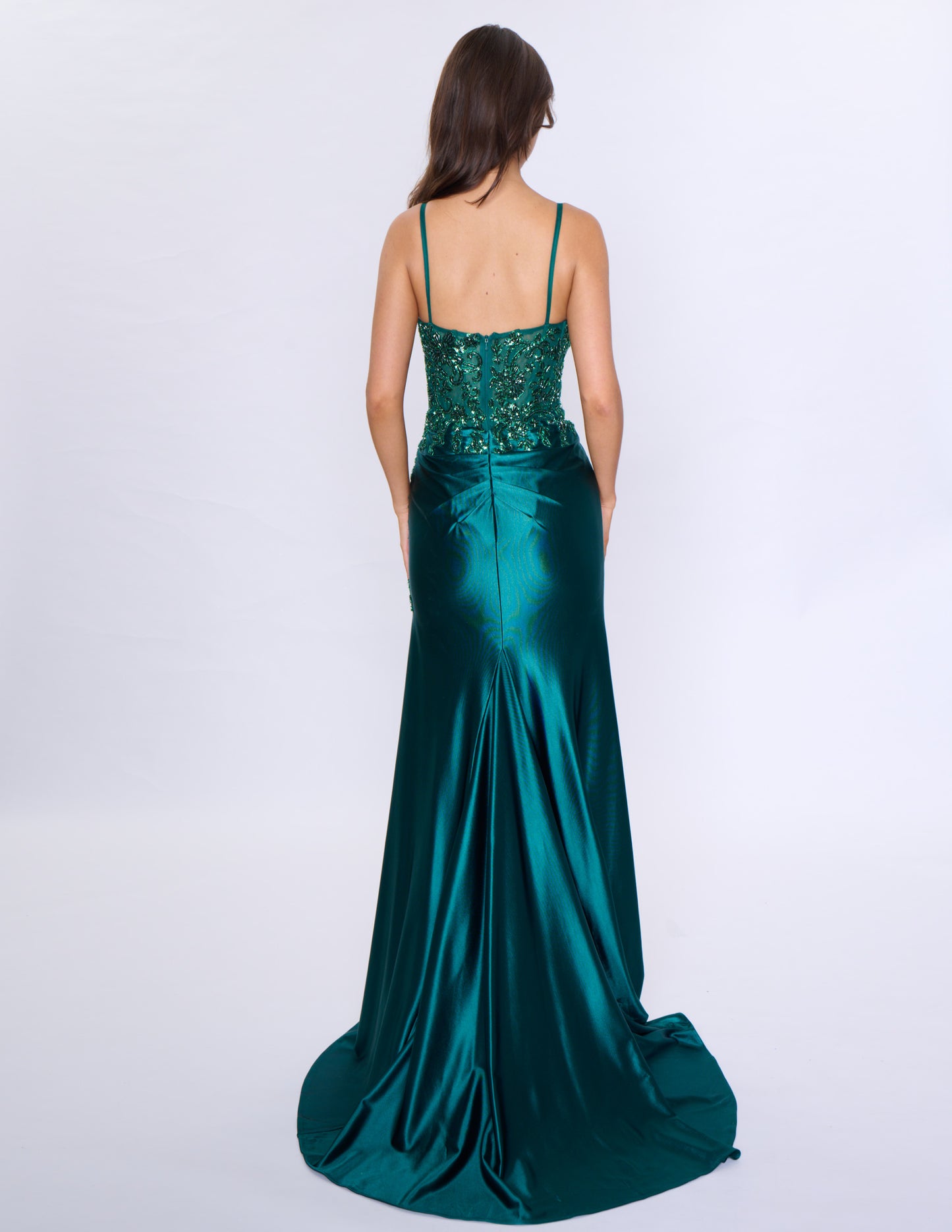 Look stunning at prom or any formal event with the Nina Canacci 1585 Fitted Sequin Long Prom Dress. This figure-hugging gown features a flattering ruched V-neckline and a daring thigh-high slit. The sequin fabric adds a touch of glamour and the long length will make you stand out.

Sizes: 0-14

Colors: Black, Emerald, Rose Gold