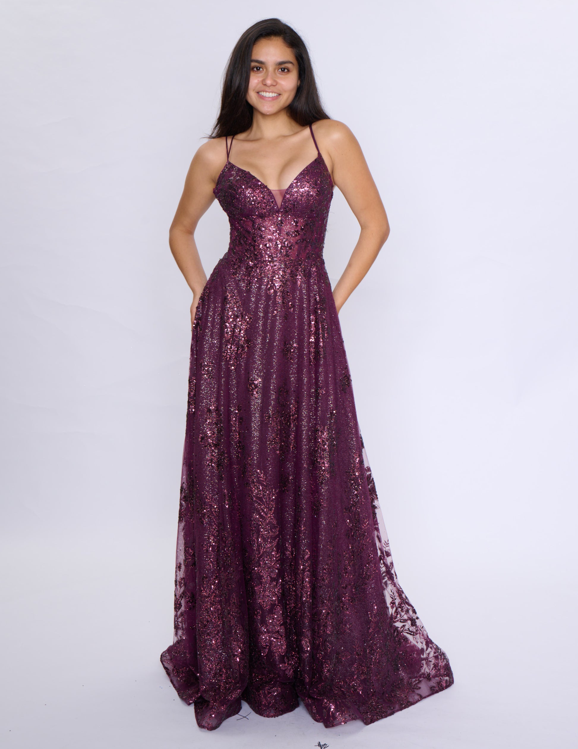 Shine at your prom with the Nina Canacci 1589 Sheer Sequin A Line Prom Dress. Featuring a corset bodice and a V-neckline, this formal evening gown will accentuate your figure. The sheer sequin fabric adds a touch of glamour to your look. Make a statement with this elegant and on-trend dress.

Sizes: 0-18

Colors: Sage, Rose Gold, Mulberry, Navy/Lilac