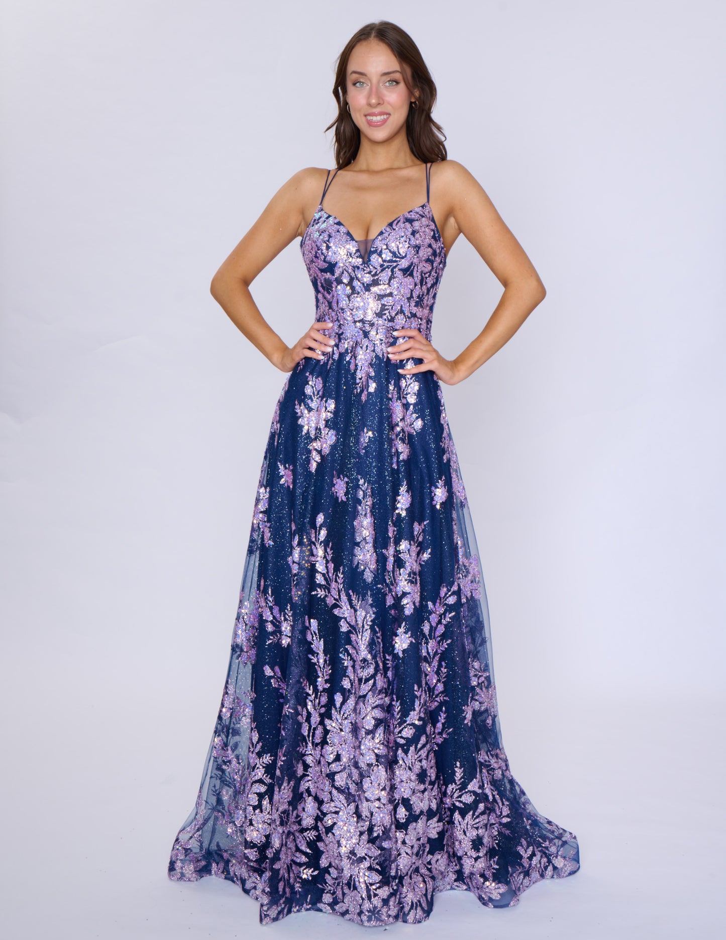 Shine at your prom with the Nina Canacci 1589 Sheer Sequin A Line Prom Dress. Featuring a corset bodice and a V-neckline, this formal evening gown will accentuate your figure. The sheer sequin fabric adds a touch of glamour to your look. Make a statement with this elegant and on-trend dress.

Sizes: 0-18

Colors: Sage, Rose Gold, Mulberry, Navy/Lilac