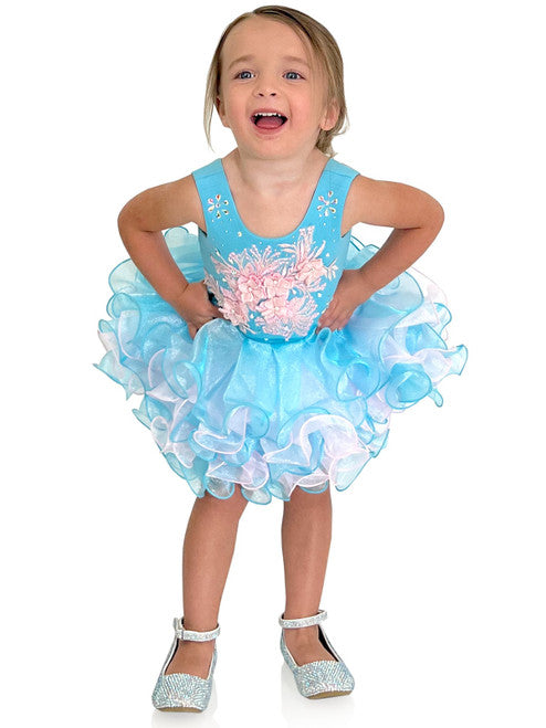 Marc Defang 5117K size 8 Turquoise girls cupcake pageant dress with pink applique on the top with crystal scattered throughout.  Multi blue and pink ruffle skirt.  Size 8  Color: Turquoise