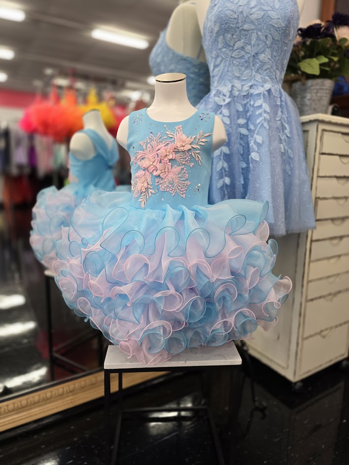 Marc Defang 5117K size 8 Turquoise girls cupcake pageant dress with pink applique on the top with crystal scattered throughout.&nbsp; Multi blue and pink ruffle skirt.

Size 8