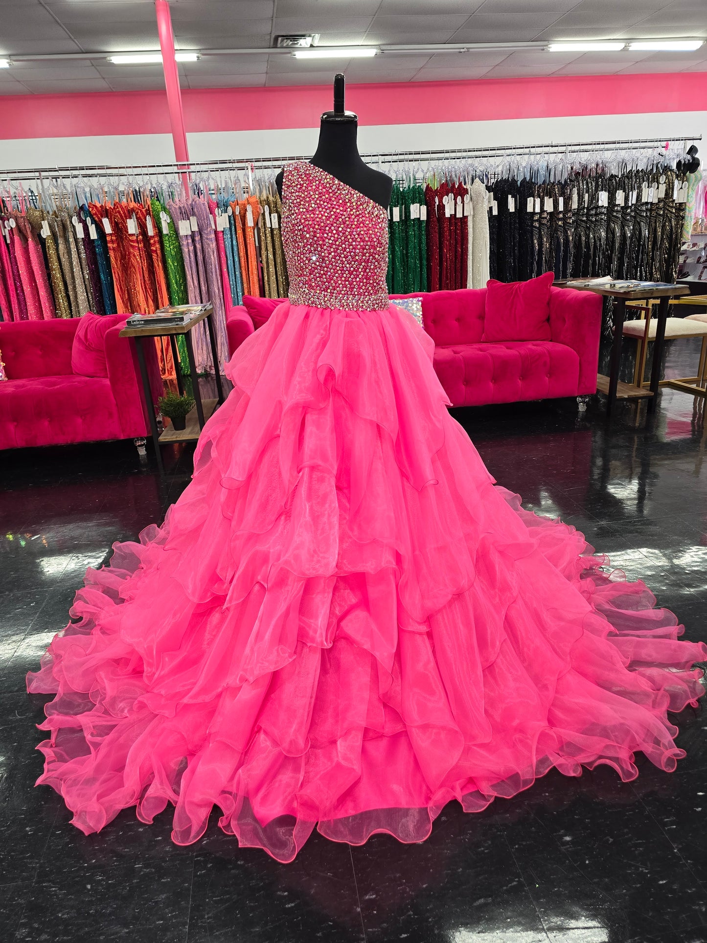 Introducing the Samantha Blake 1025 Girls Long Pageant Dress. Made with Chiffon Ruffle layers and a one shoulder design, this gown exudes elegance and sophistication. Perfect for formal events and pageants, your little girl will shine and feel like a princess in this stunning dress.&nbsp;