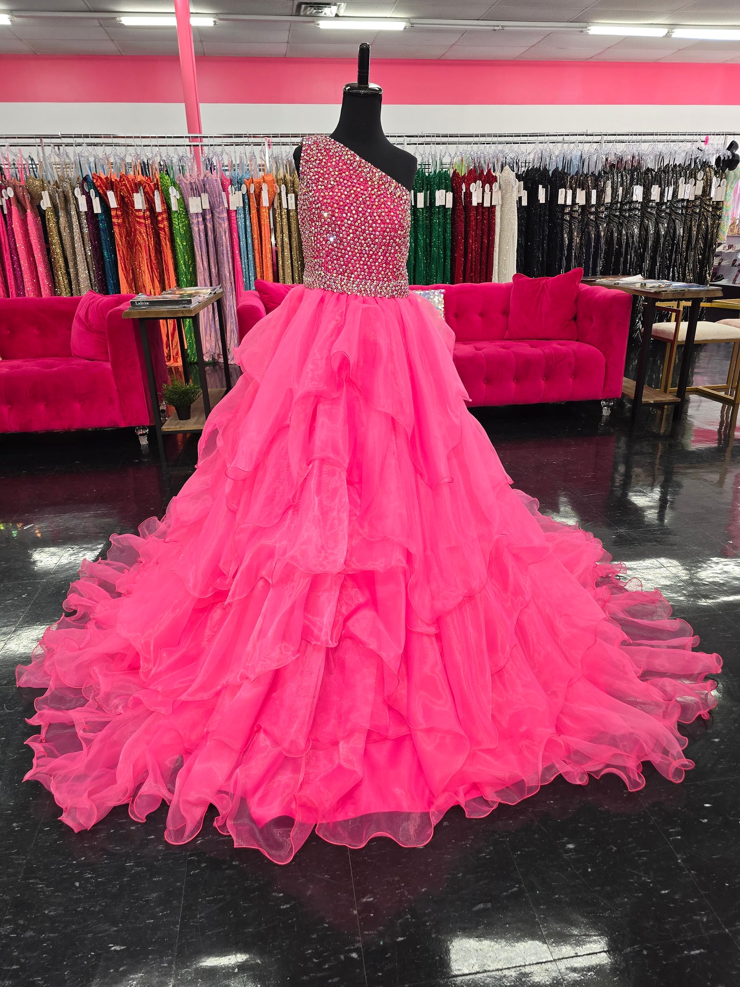 Introducing the Samantha Blake 1025 Girls Long Pageant Dress. Made with Chiffon Ruffle layers and a one shoulder design, this gown exudes elegance and sophistication. Perfect for formal events and pageants, your little girl will shine and feel like a princess in this stunning dress.&nbsp;