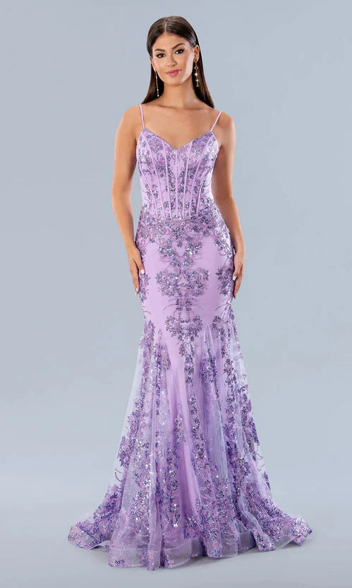 Stella Couture 21066 is a stunning V neckline glitter embellished fitted mermaid prom & Pageant Dress. Featuring a corset design bodice with boning and a v neckline. Lush mermaid silhouette with a sweeping train. sheer back. Great for Prom & Pageant  Available Size: 0-18  Available Color: Black, Blue, Emerald Green, Fuchsia, Gold, Lilac, Lipstick Navy, Pink, Royal, Silver