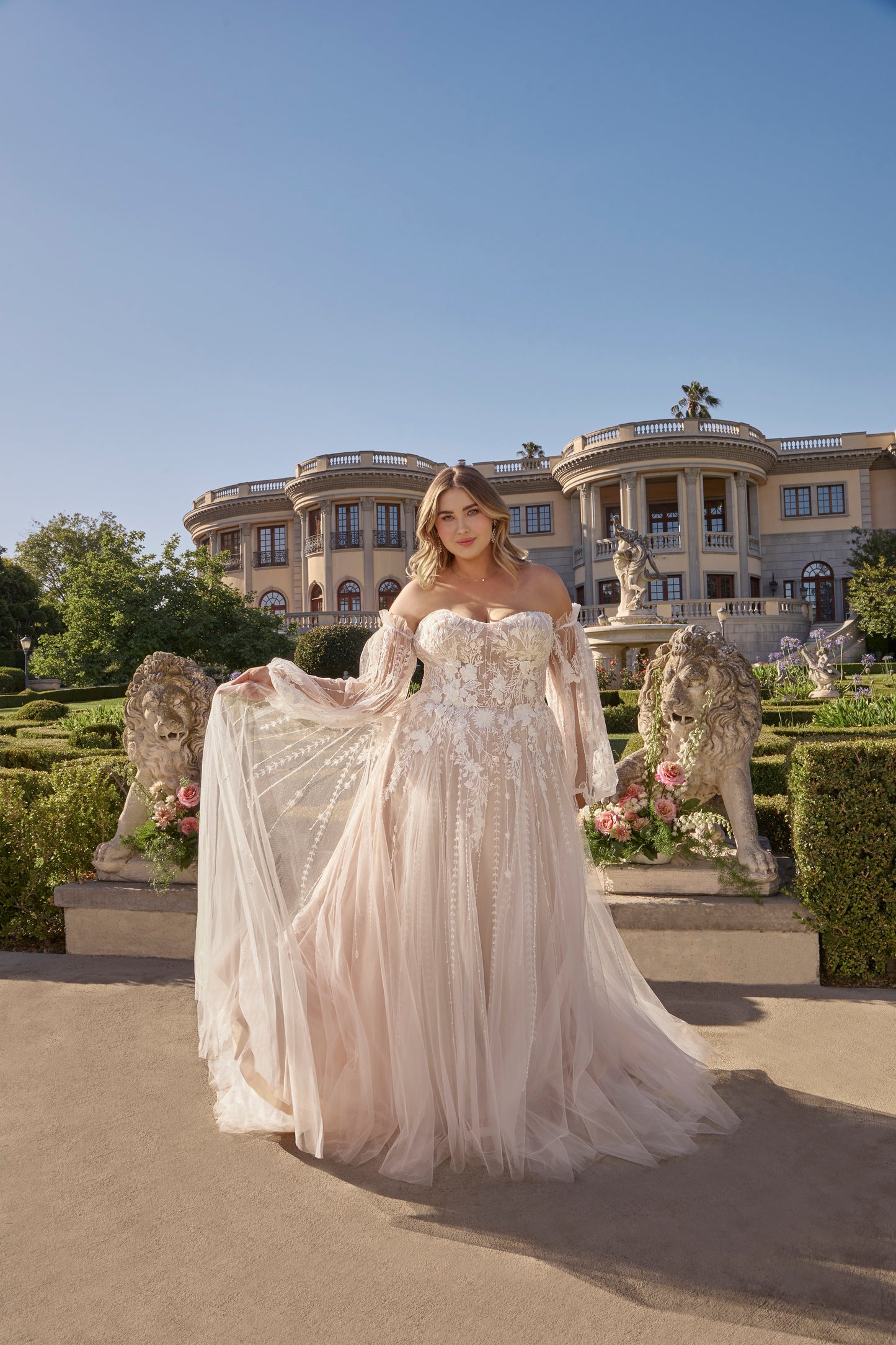 Introducing the epitome of elegance and luxury, the Casablanca Bridal 2496 wedding dress. With its stunning sheer beaded details and effortless A-line silhouette, this gown will make any bride feel like a work of art on her special day. The strapless design adds a touch of romance, making it the perfect choice for a bohemian-inspired wedding. Elevate your bridal look with this exclusive Casablanca creation. Let love bloom in Style 2496 Petal by Casablanca, an irresistibly sweet strapless A-line wedding dres