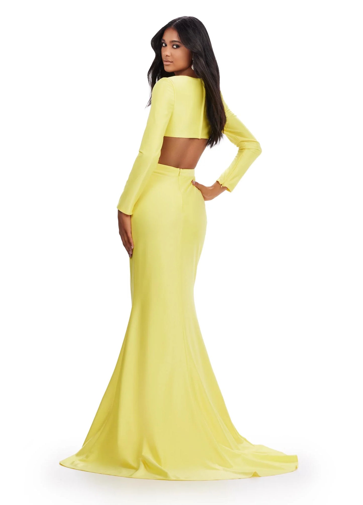 Look fabulous on prom night in the Ashley Lauren 11607 Jersey Cutout Dress. Cut from stretch jersey, this formal gown features a fitted skirt with a high side slit, long sleeves, and a scoop neckline with cutout detail. Make an unforgettable entrance in this figure-flattering style. Be unique in this v-neckline gown with crisscross cut out bodice. The look is accented with a fitted draped skirt and long sleeves.  COLORS: Yellow, Turquoise, Hot Pink, Coral