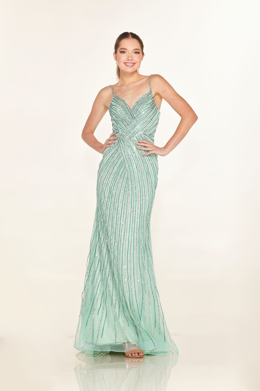 Elevate your style with the Cecilia Couture 2616 Long Crystal Prom Dress. This stunning gown features a corseted bodice and a dazzling crystal shimmer, perfect for any formal evening event. The V neckline adds a touch of elegance, making you stand out in the crowd. Feel confident and beautiful in this glamorous dress.