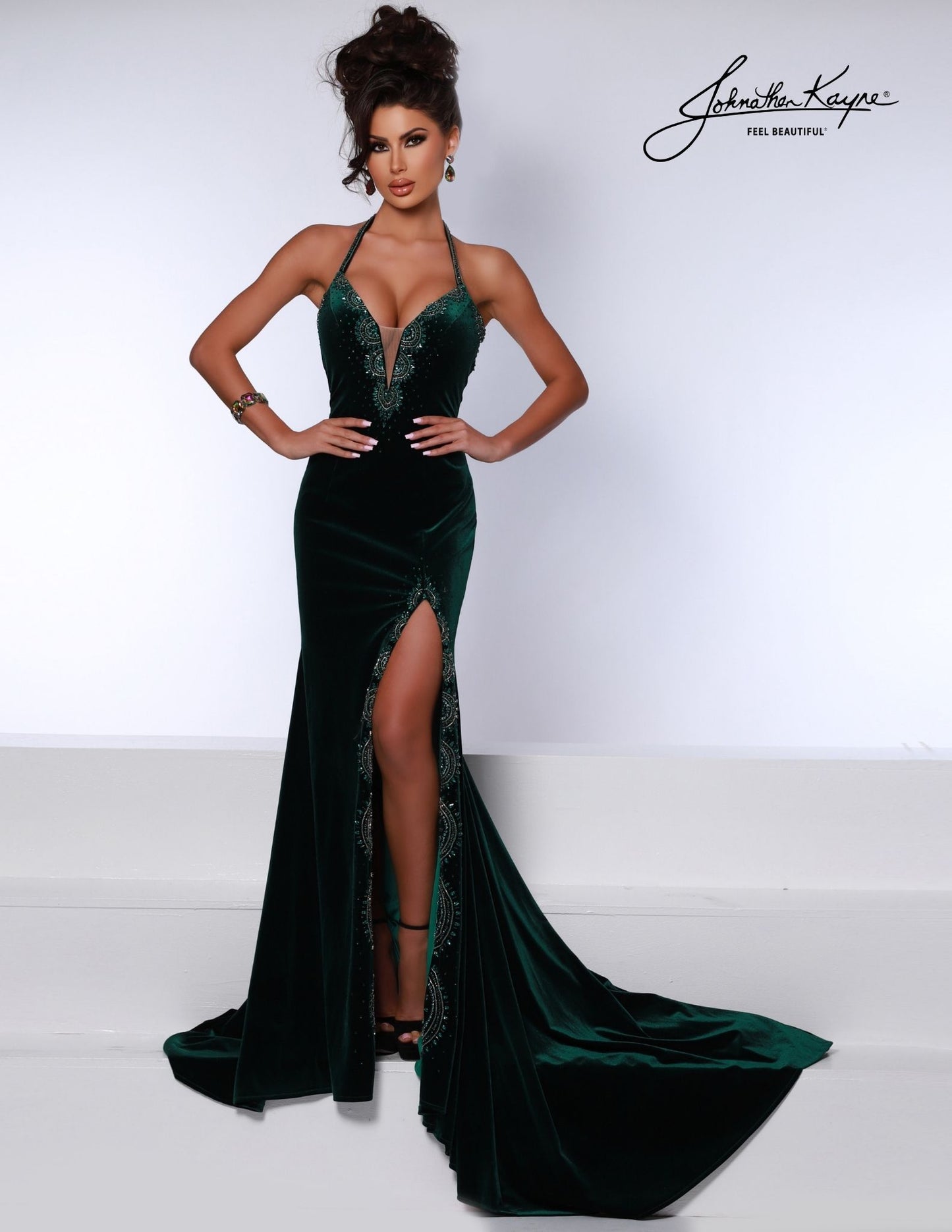 Johnathan Kayne 2737 Plunging neckline velvet evening gown halter straps embellished crystal high slit  Look your best in the luxurious Johnathan Kayne 2737 evening gown. Crafted from velvety soft fabric, it features a plunging neckline, halter straps, and a high front slit, highlighted by dazzling crystal embellishments. Let its elegance sparkle on your special occasions.  Sizes: 00,0,2,4,6,8,10,12,14,16  Colors: Black, Emerald , Red, Royal 