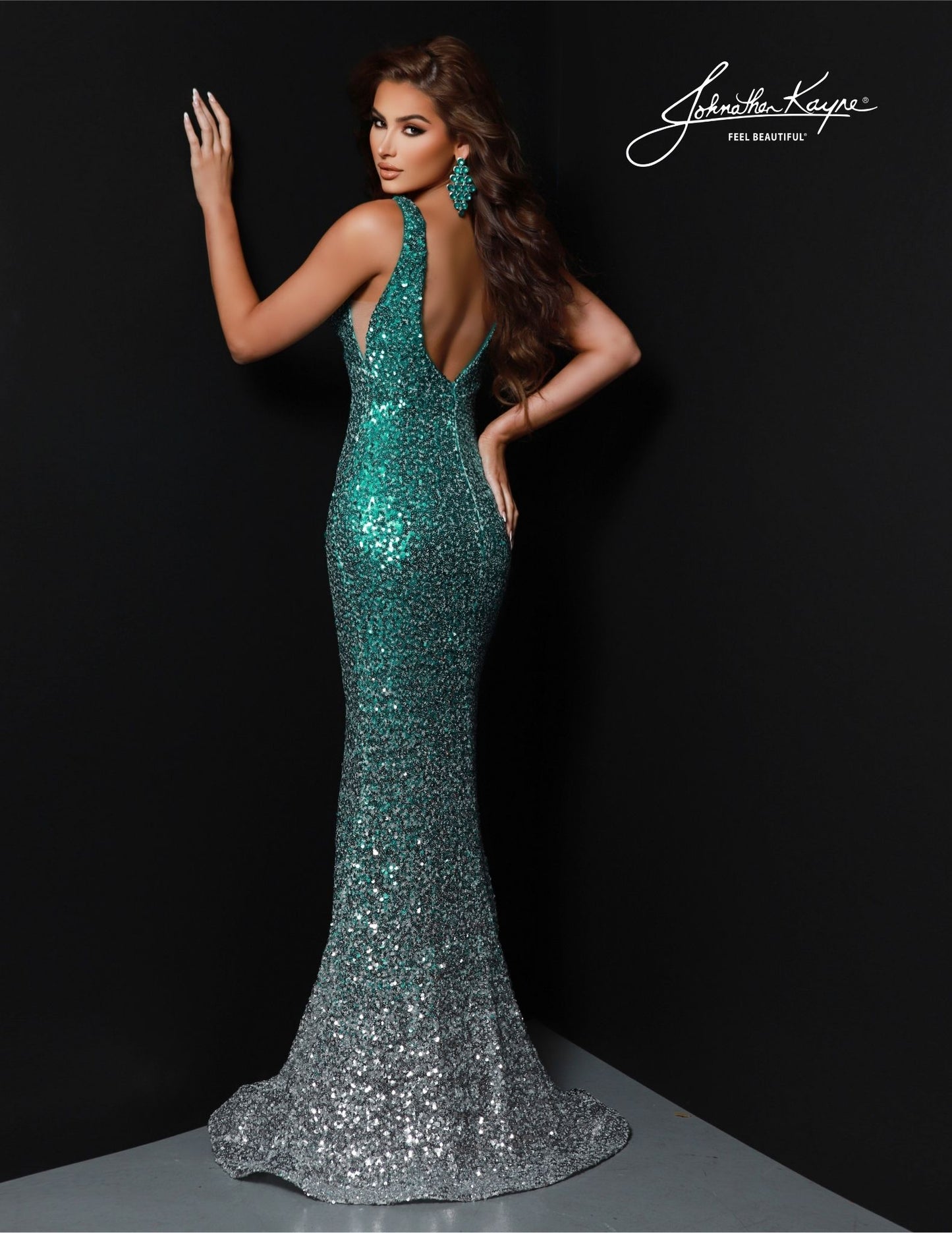 Look your best at any formal occasion in this Johnathan Kayne 2814 Long Prom Dress. With features such as a mermaid silhouette, v-neck, and sequin bodice, this dress is perfect for prom or any special event. An open back completes the look, allowing you to show off your style. Look stunning in this beautiful gown.