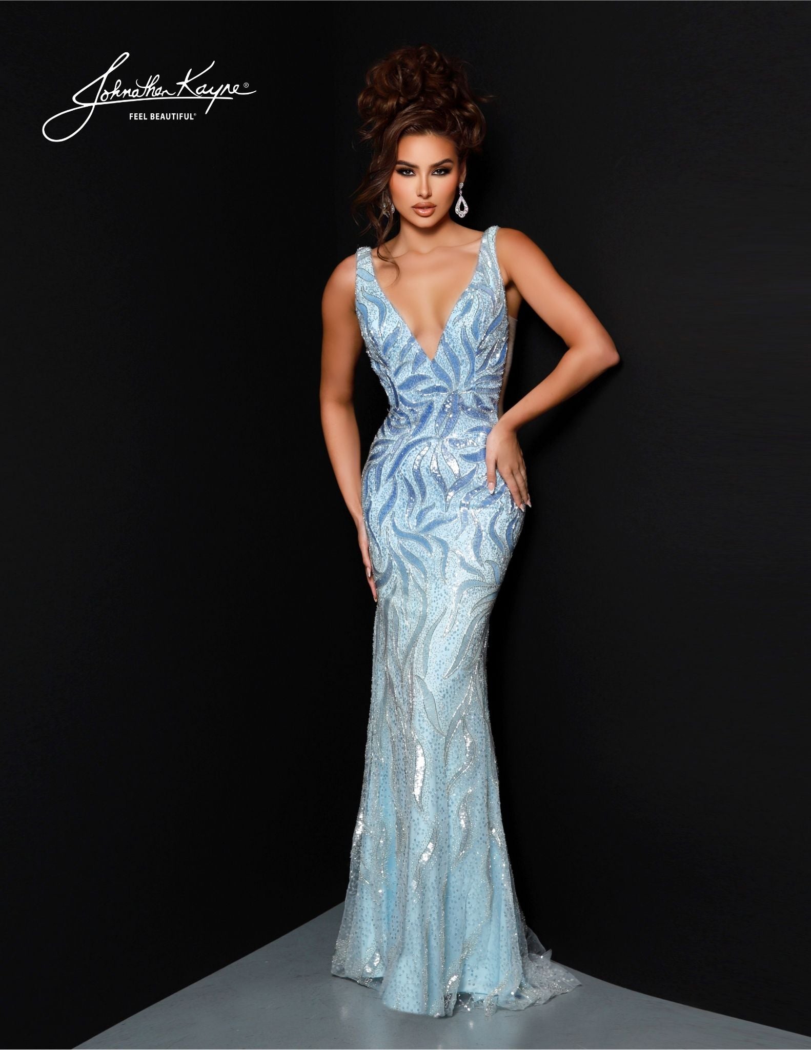 Johnathan Kayne's 2824 Long Prom Dress is perfect for a formal event. Crafted with a flattering mermaid silhouette and beaded choker cape, this elegant gown features a V-neckline, fitted waist and full-length hem. Ideal for pageants or proms. Drape yourself in luxury! This stunning gown features intricate beadwork on a mesh overlay, providing a captivating, shimmering effect. The detachable cape with choker adds a touch of drama and sophistication.