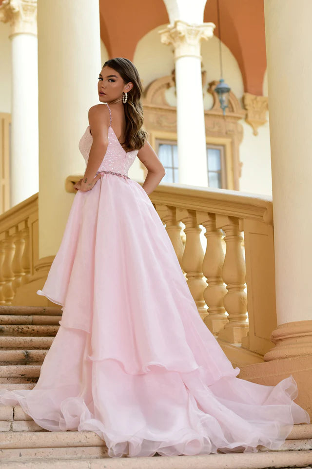 Look stunning in the Ava Presley 28560 Long Sequin Gown. With a removable organza skirt, this dress is perfect for prom or formal pageants. The sequin detailing adds a touch of glamour while the removable skirt allows for versatility in styling. Make a statement with this elegant and sophisticated gown.