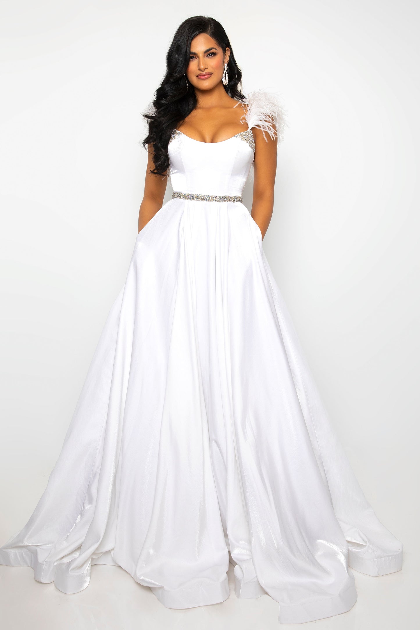 This classic ballgown from Ava Presley is crafted from lightweight fabric with off-the-shoulder feather straps. Featuring a fitted bodice and full A-line skirt, this elegant dress is perfect for formal occasions. Step out in style with this timeless formal gown.  Sizes: 00-24  Colors: Black, White, Coral Pink