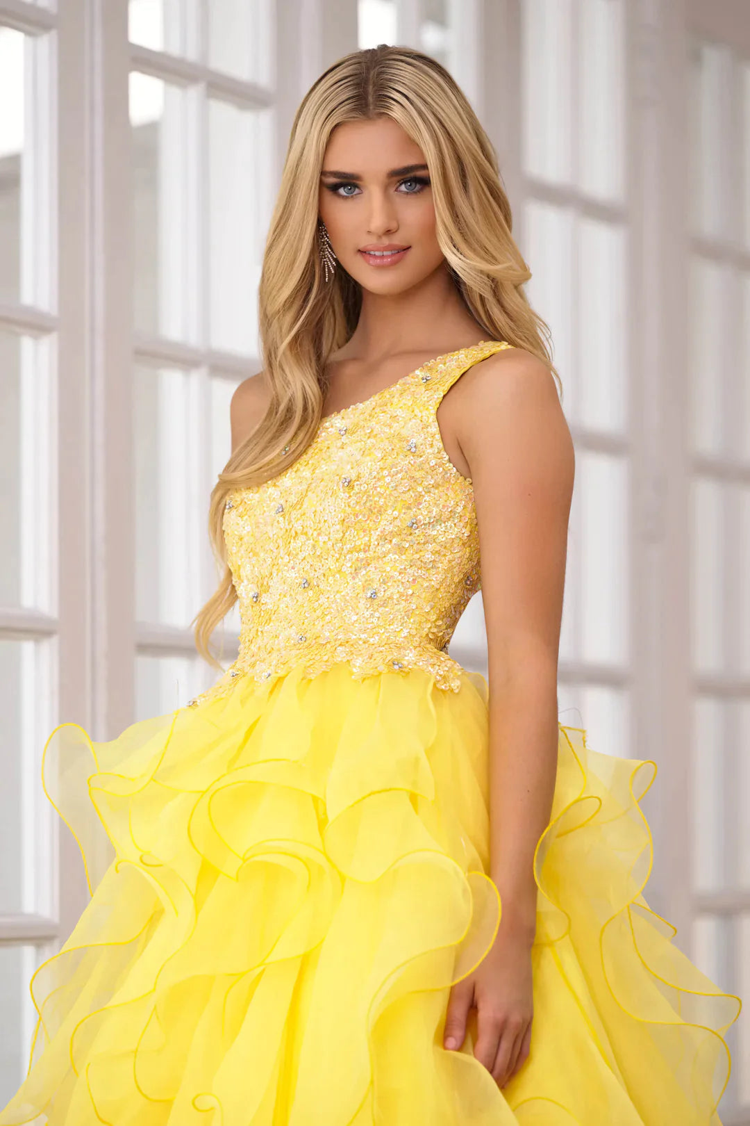 Be the belle of the ball in the Ava Presley 28576 Long Prom Dress. The chic one shoulder design and sparkling sequin bodice will turn heads, while the layered organza skirt adds dramatic flair. Perfect for formal events and pageants.