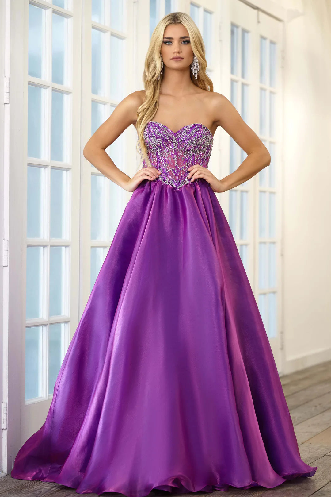 Expertly crafted by Ava Presley, the 28588 Long Prom Dress boasts a strapless, open back design that accentuates the A-line ballgown silhouette. The crystal bodice adds a touch of glamour, making it the perfect choice for a formal event or pageant. Show off your elegant style with this stunning dress.