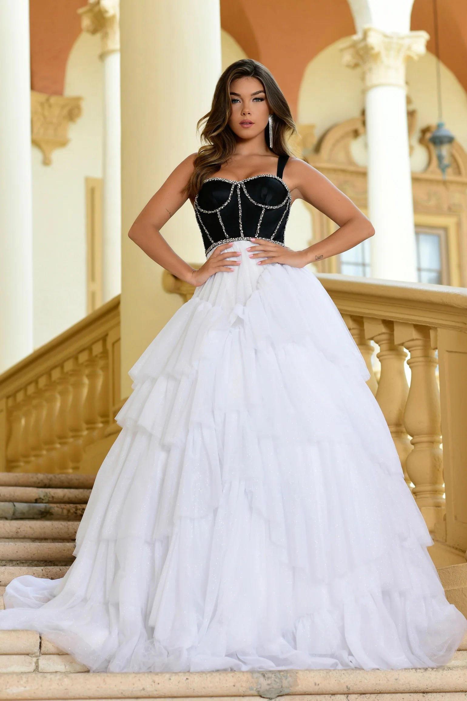 Step out in style with the Ava Presley 28592 Shimmer Tulle A Line Layer Ballgown Prom Dress. This stunning gown features a satin corset and crystal embellishments for a touch of elegance. The A-line silhouette and layered tulle skirt will make you feel like a princess. Perfect for prom or any special occasion.  Sizes: 00-16  Colors: Lilac, Black/White