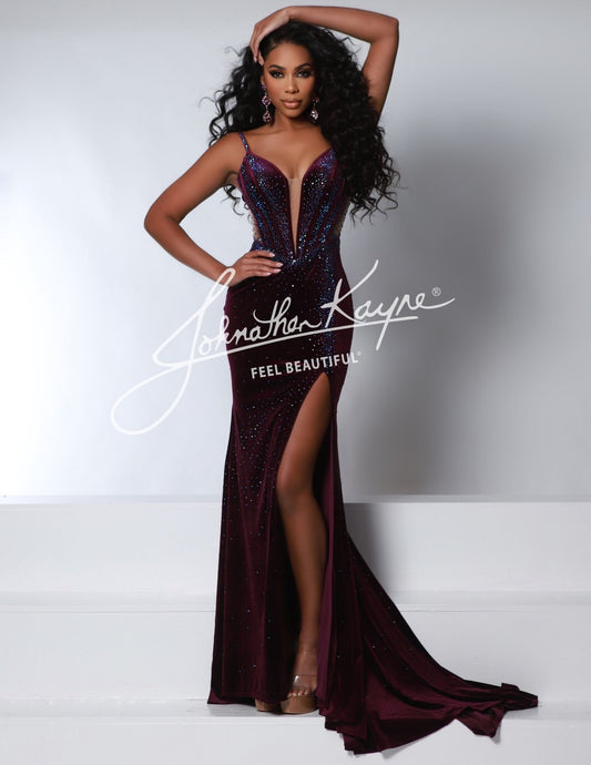 Be the center of attention in the Johnathan Kayne 2948 Long Velvet Sheer Formal Dress. This stunning dress features a luxurious velvet fabric, a sheer design, and a dramatic slit that will make you stand out at any formal event.