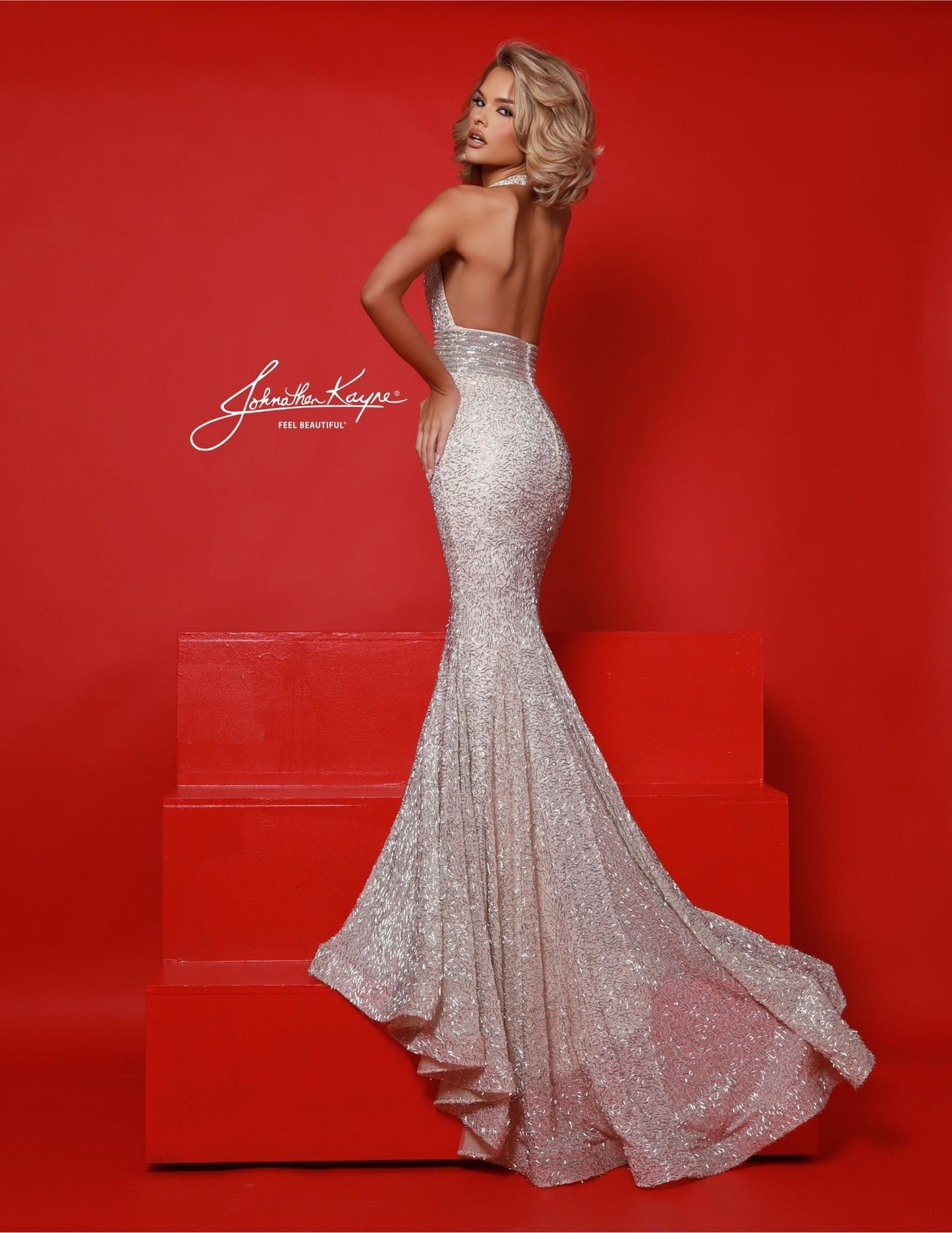 Elevate your evening look with the Johnathan Kayne 3090 pageant dress. Adorned with shimmering crystal beading and a flattering mermaid silhouette, this halter gown exudes elegance and sophistication. Perfect for any formal occasion, make a statement in this timeless and stunning piece. Marilyn Monroe vibes! Step into a dream with this beaded halter dress. Classic neckline, flirtatious open back, and whimsical horsehair hem create a dance floor masterpiece. Fit for the fearless, this dress turns every momen