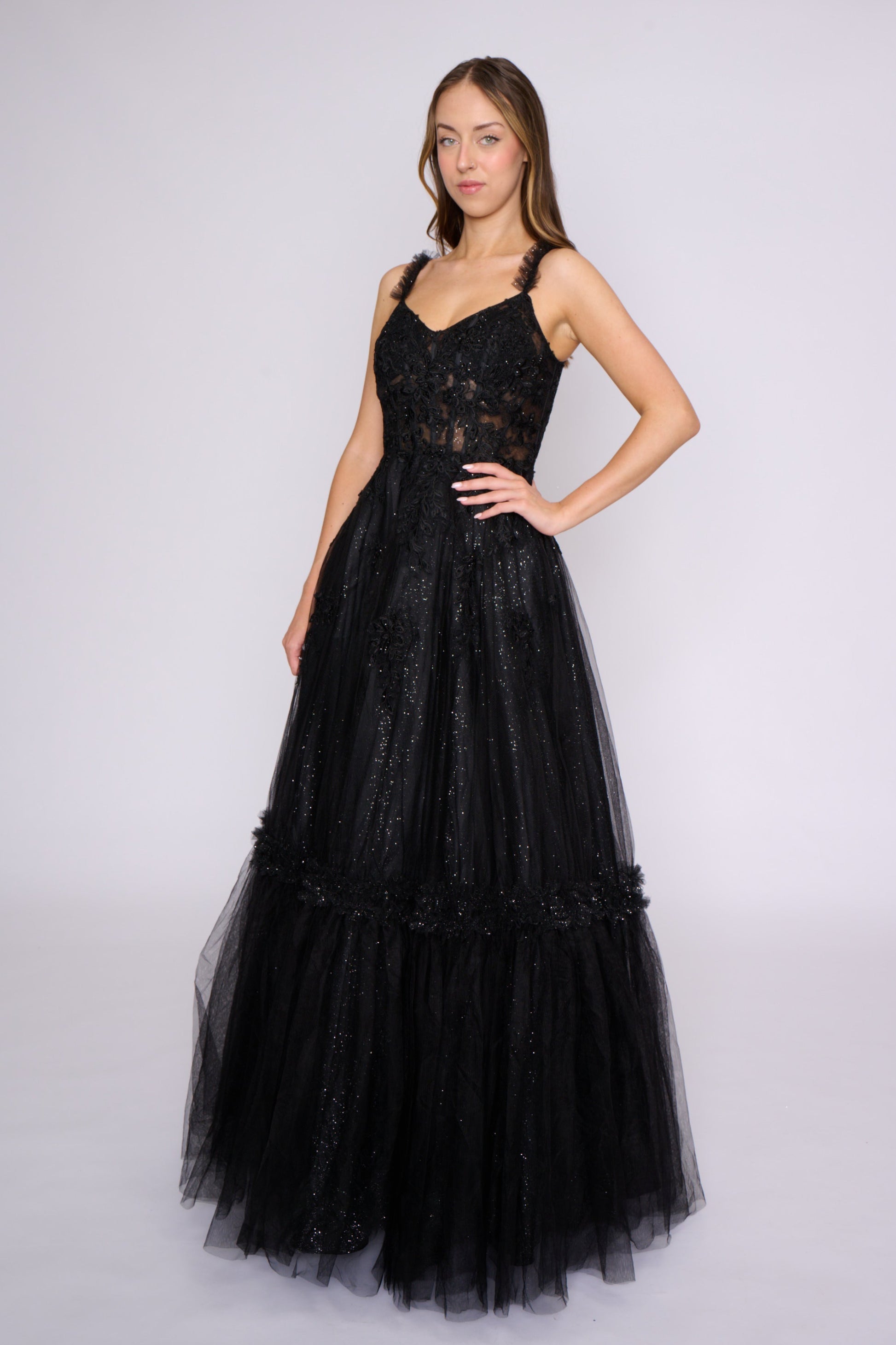 This Nina Canacci 3272 prom dress features a shimmering lace corset and pleated A-line ballgown silhouette, creating a stunning and sophisticated look. The backless design adds a touch of allure, while the structured corset provides a flattering fit. Perfect for any formal occasion.

Sizes: 4, 8

Colors: Black