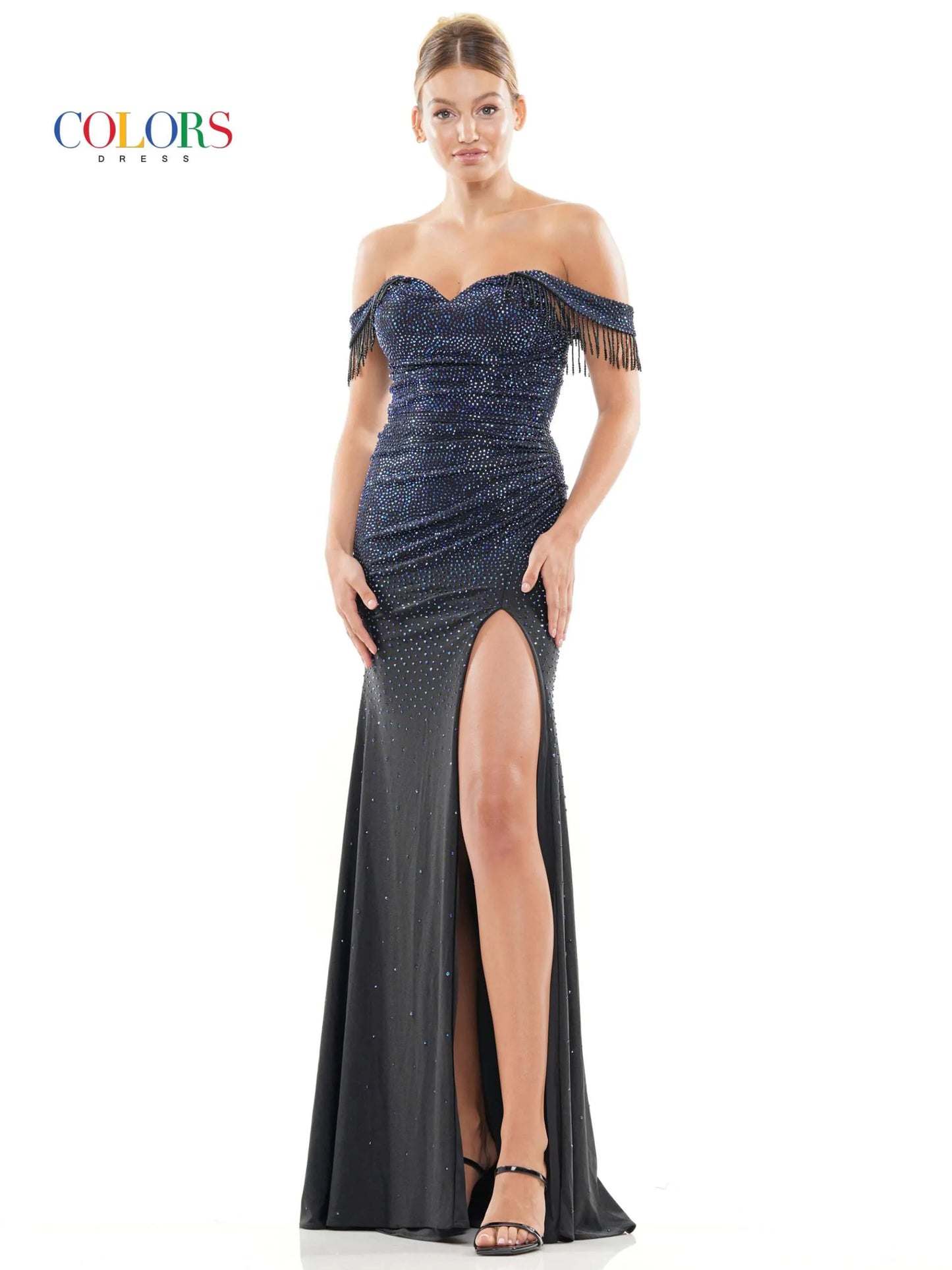 This Colors Dress 3288 Crystal off the shoulder Prom Dress is designed to make you stand out at any formal event. With its elegant off the shoulder neckline, crystal embellishments, and flowing fringe details, this dress exudes glamour and sophistication. The high slit adds a touch of allure, making you feel confident and beautiful.  Sizes: 0-22  Colors: Black, Deep Green, Turquoise