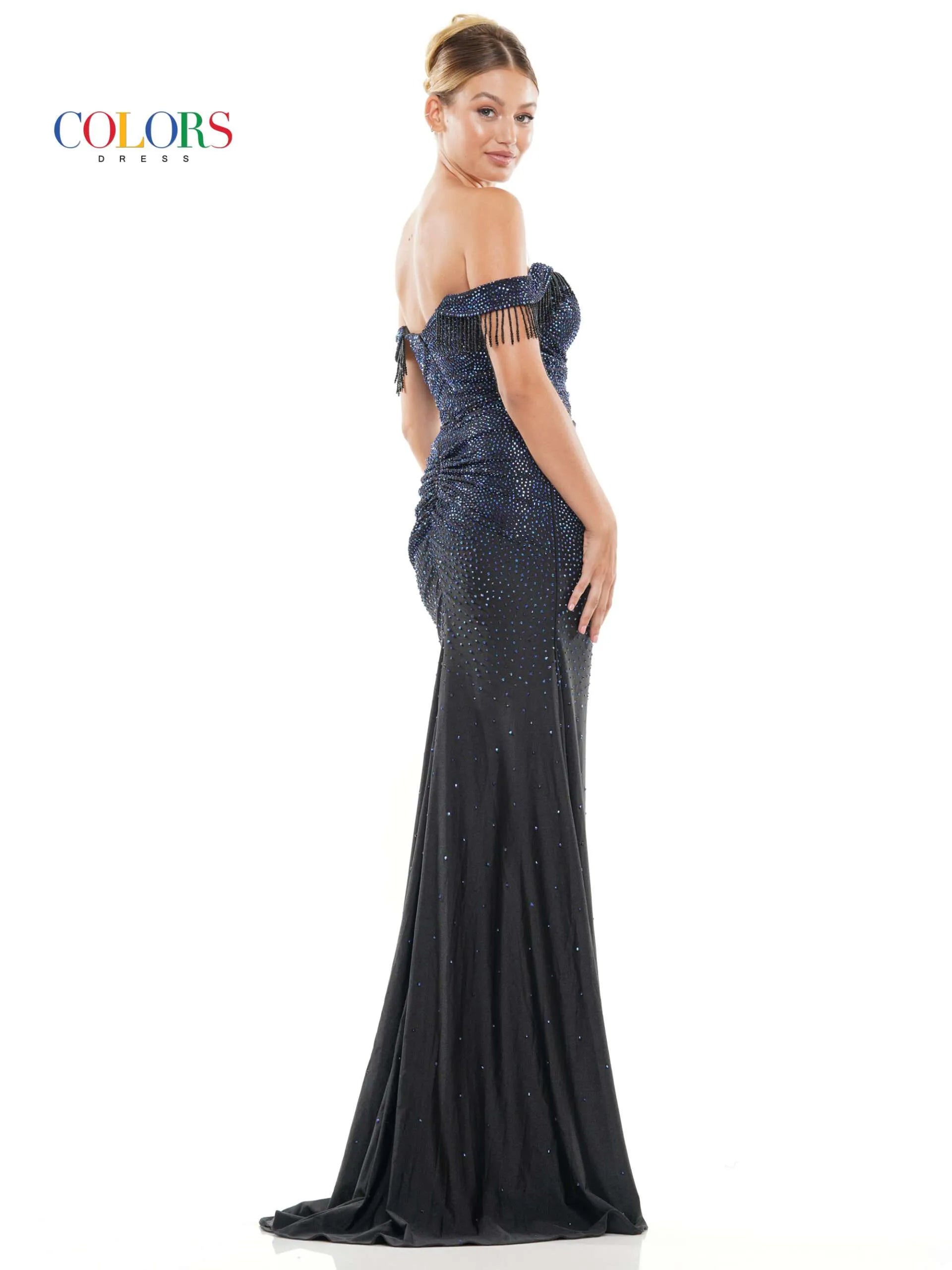 This Colors Dress 3288 Crystal off the shoulder Prom Dress is designed to make you stand out at any formal event. With its elegant off the shoulder neckline, crystal embellishments, and flowing fringe details, this dress exudes glamour and sophistication. The high slit adds a touch of allure, making you feel confident and beautiful.  Sizes: 0-22  Colors: Black, Deep Green, Turquoise