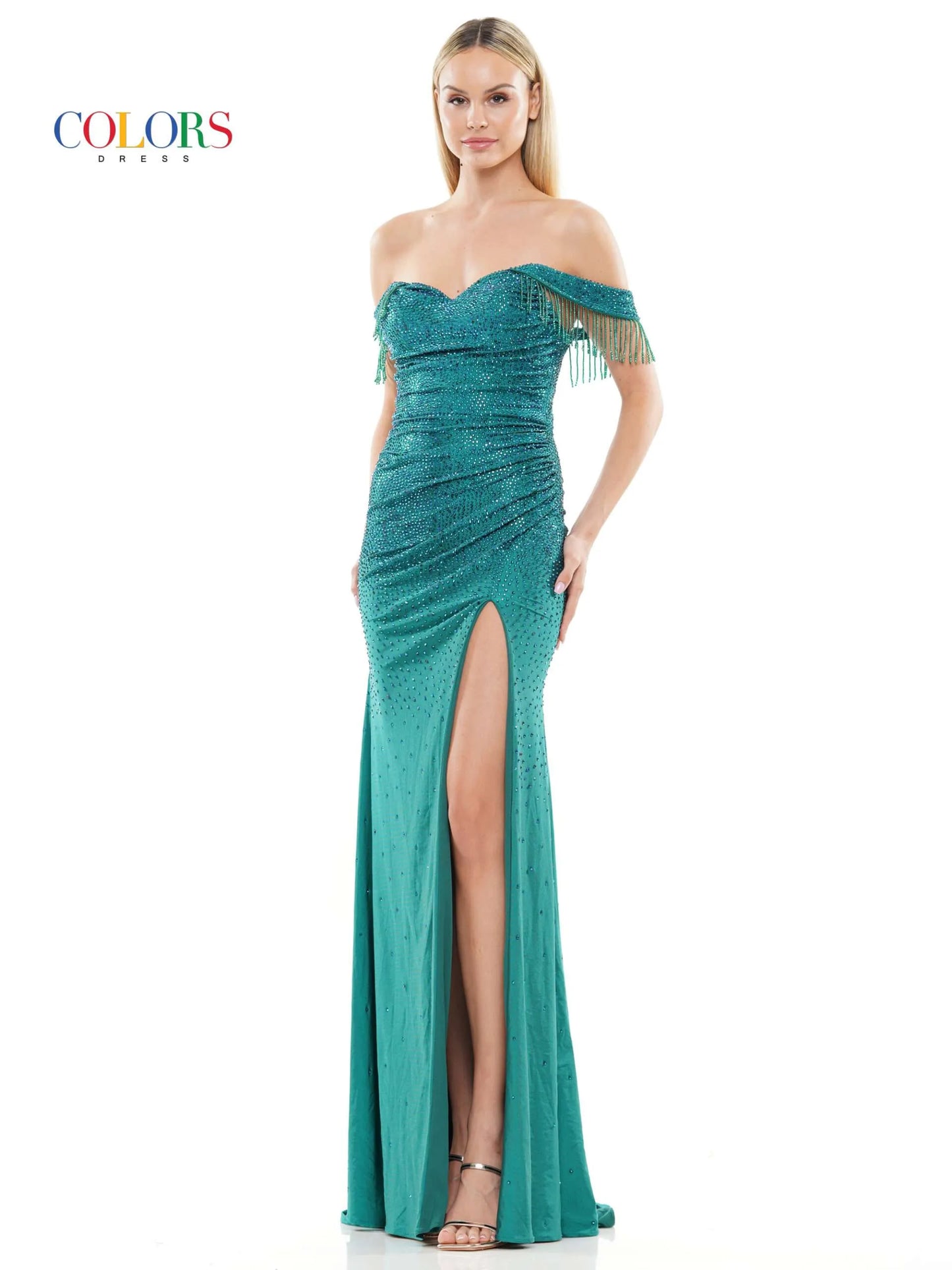 This Colors Dress 3288 Crystal off the shoulder Prom Dress is designed to make you stand out at any formal event. With its elegant off the shoulder neckline, crystal embellishments, and flowing fringe details, this dress exudes glamour and sophistication. The high slit adds a touch of allure, making you feel confident and beautiful.  Sizes: 0-22  Colors: Black, Deep Green, Turquoise