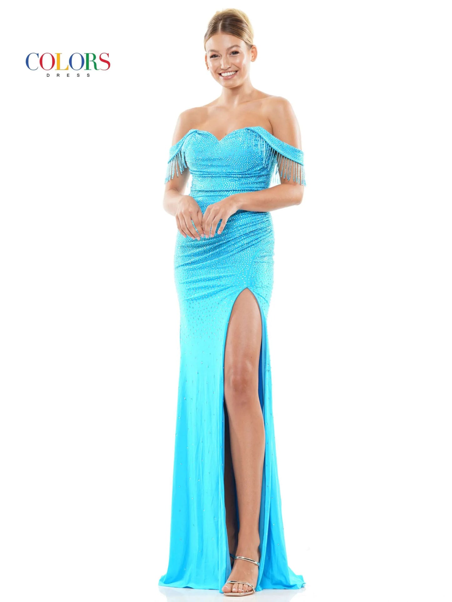 This Colors Dress 3288 Crystal off the shoulder Prom Dress is designed to make you stand out at any formal event. With its elegant off the shoulder neckline, crystal embellishments, and flowing fringe details, this dress exudes glamour and sophistication. The high slit adds a touch of allure, making you feel confident and beautiful.  Sizes: 0-22  Colors: Black, Deep Green, Turquoise