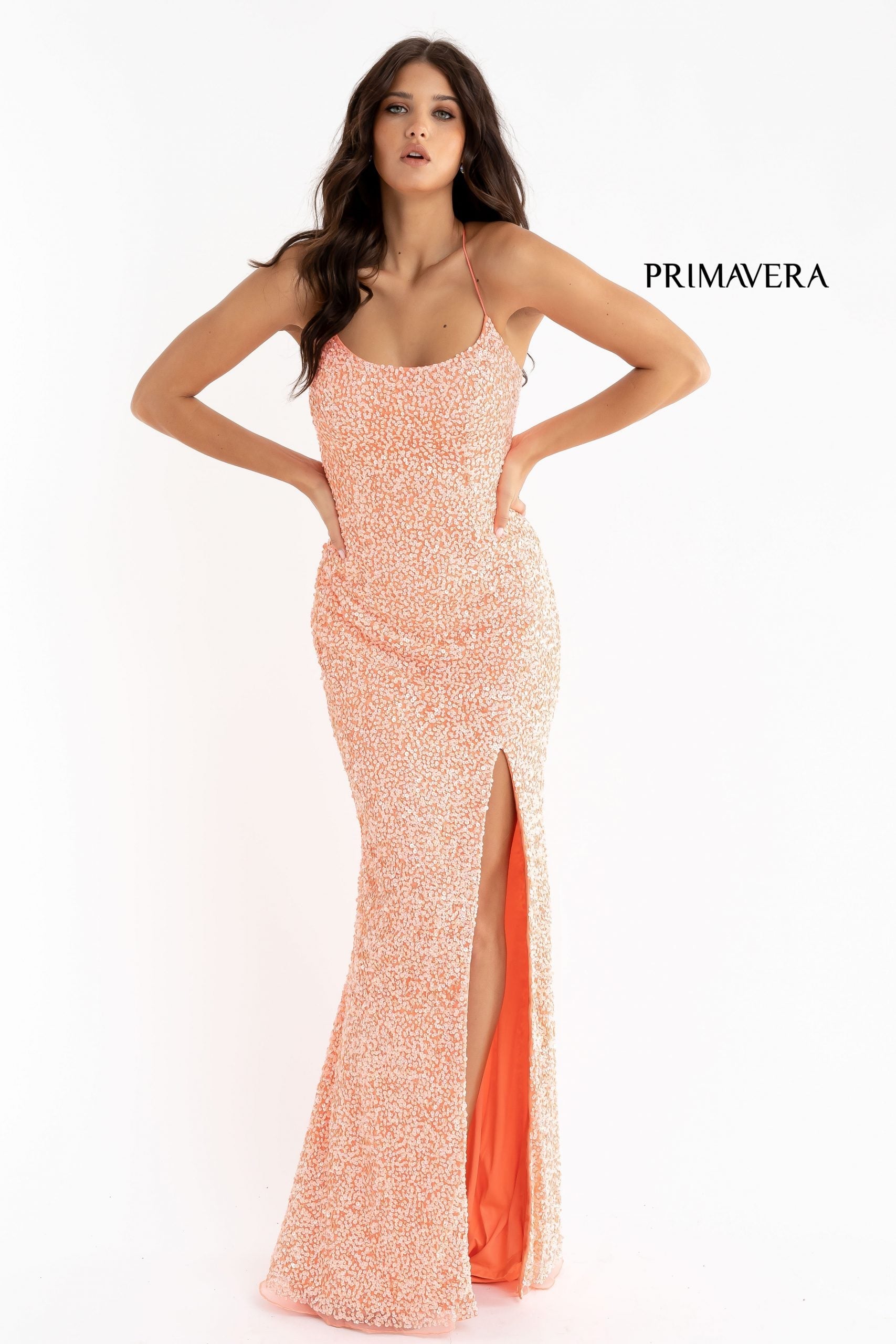 Primavera Couture 3290 This prom dress adds a pop to the multi sequins dress.  With a scoop neckline and spaghetti straps that cross and tie in the back.  This long evening dress has a side slit.  Available sizes:  000, 00, 0, 2, 4, 6, 8, 10, 12, 14, 16