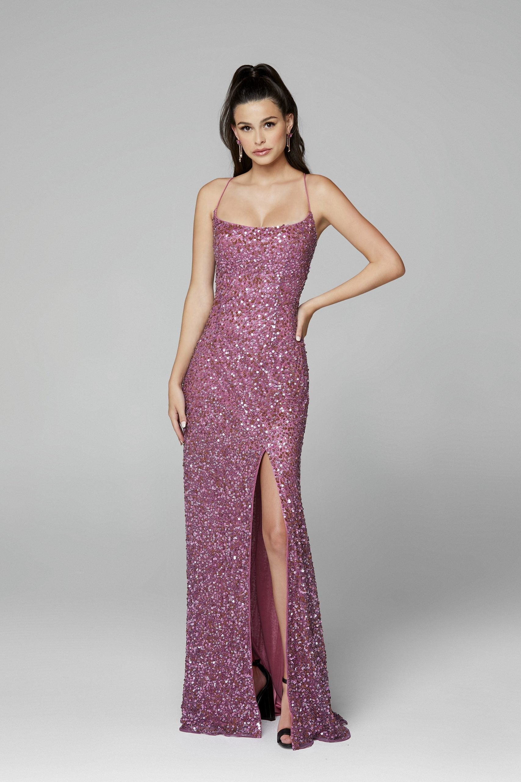 Primavera Couture 3290 This prom dress adds a pop to the multi sequins dress.  With a scoop neckline and spaghetti straps that cross and tie in the back.  This long evening dress has a side slit.  Available sizes:  000, 00, 0, 2, 4, 6, 8, 10, 12, 14, 16