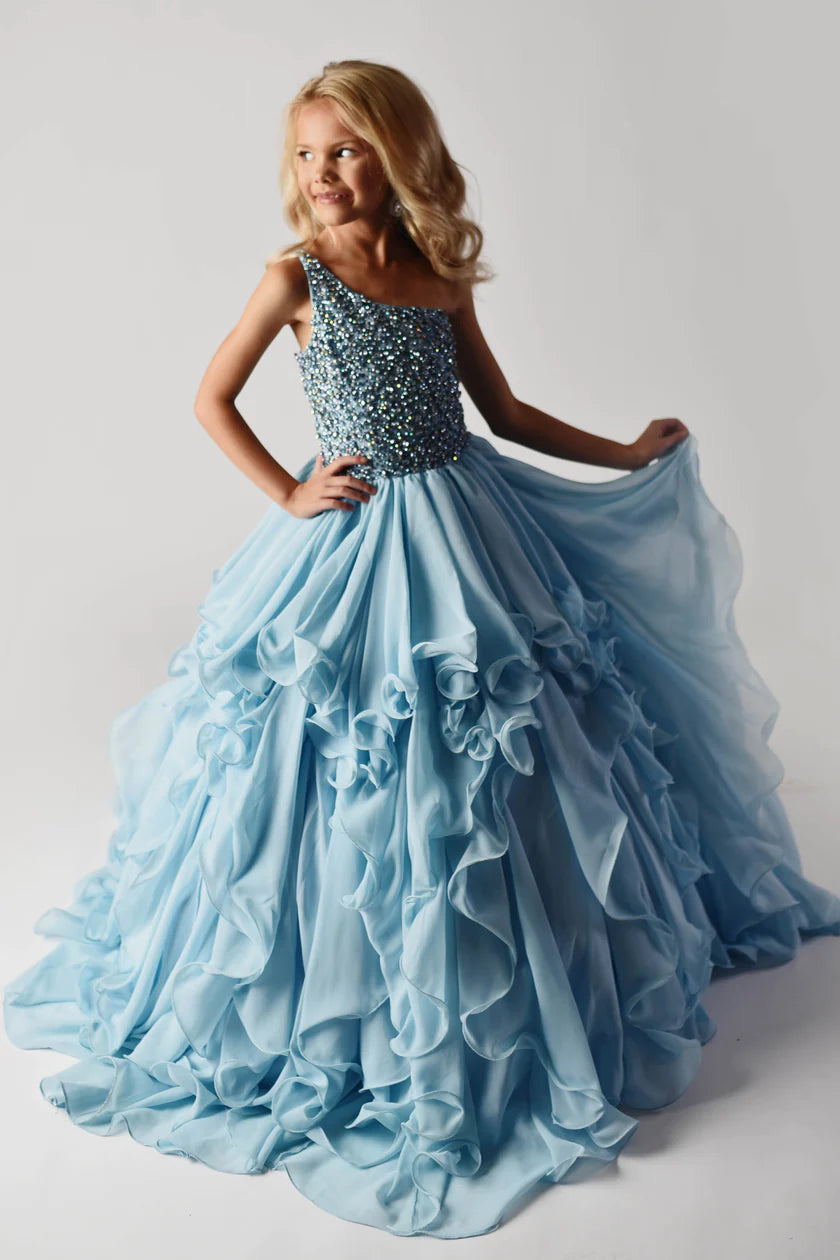 Ava Presley 38024 offers an elegant, timeless look with its Long Ruffle Layer and Beaded Bodice. This one Shoulder dress is made with high quality fabric for ultimate comfort and style. Perfect for special events and pageants, this timeless design will make any girl shine.  Sizes: 2-16  Colors: Blush, Light Blue, Red, White, Royal