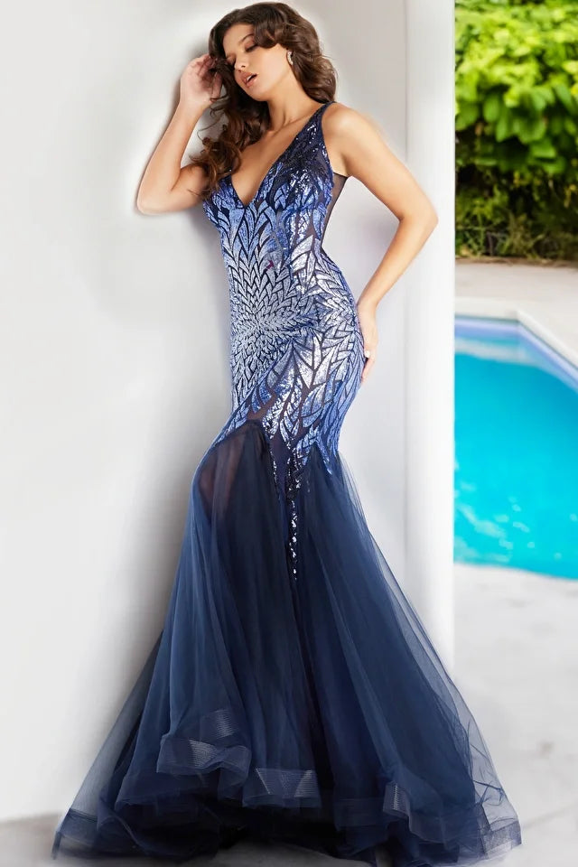 The Jovani 38373 is a breathtaking formal gown designed to make a dramatic statement at special occasions. It is crafted from tulle, a lightweight and ethereal fabric that adds a touch of romance and elegance to the dress. The dress features a mermaid silhouette, known for its dramatic and figure-hugging design that flares out at the bottom, emphasizing the wearer's curves and creating a sophisticated and alluring silhouette.