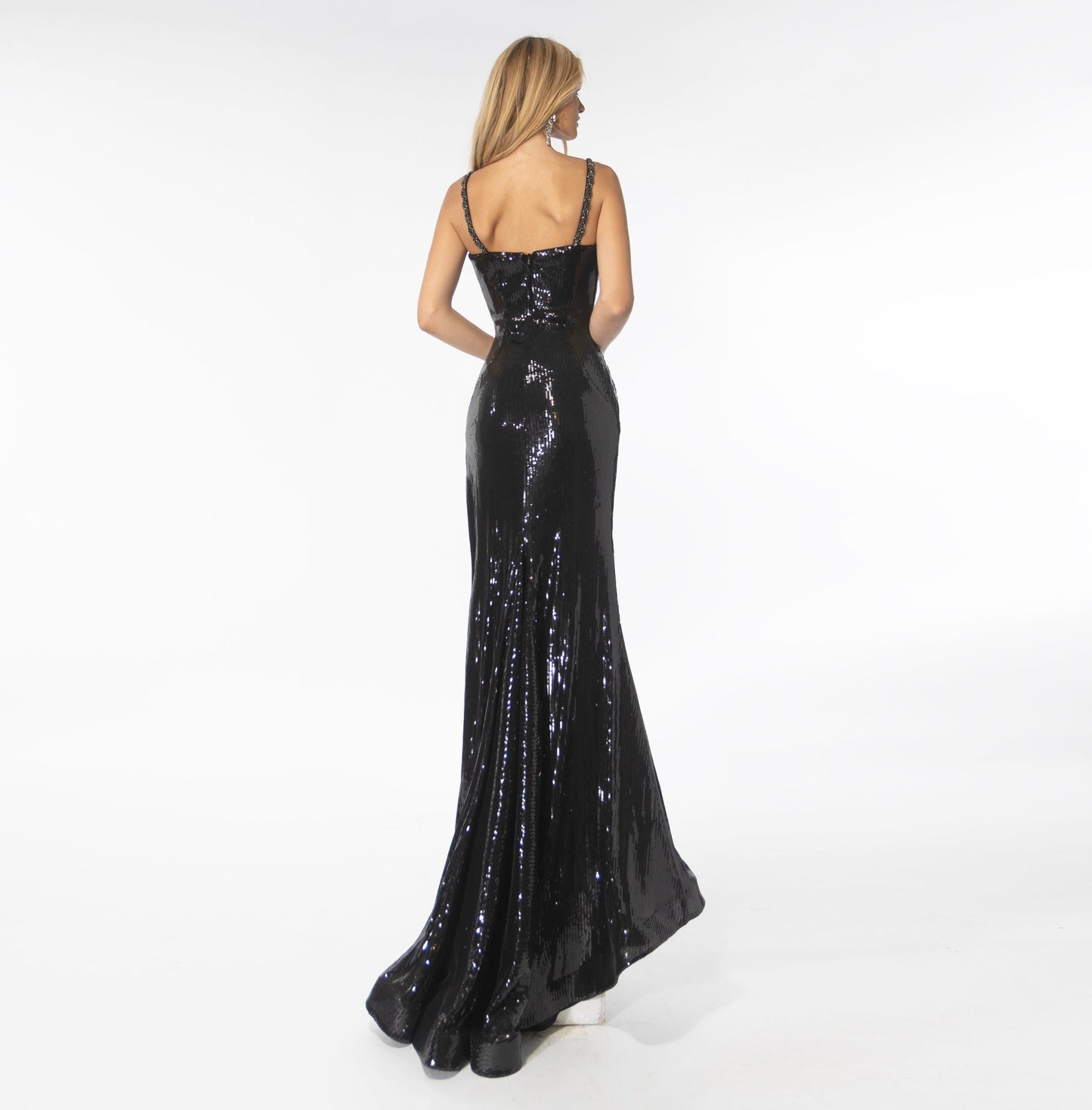 Make a grand entrance in this stunning Ava Presley 39261 gown. Crafted from lightweight sequins, this fitted long dress features a deep V-neckline, a low back, a thigh-high slit, and a gracefully sweeping train. Elegant crystals accent the neckline, highlighting an already beautiful silhouette. A timeless choice for your special occasion.  Size: 00-14   Colors: Iridescent Pink, Black