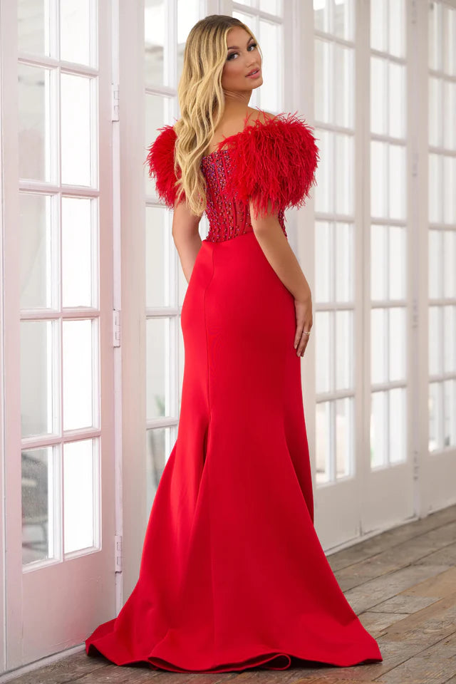 Experience the ultimate elegance in the Ava Presley 39279 Long Prom Dress. The off-shoulder feather gown is enhanced by a sheer corset bodice, perfect for formal events and pageants. Channel your inner beauty with this luxurious and show-stopping piece.