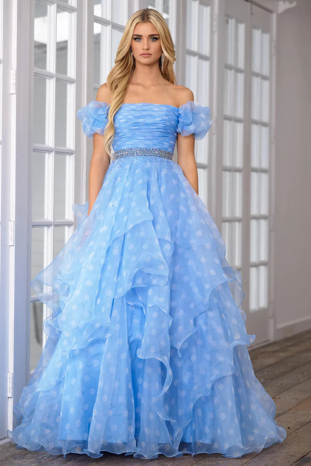 This Ava Presley 39318 prom dress is the perfect choice for any formal occasion. Its off the shoulder design and open back add a touch of elegance, while the layered organza ruffles create a unique and flattering silhouette. Turn heads and feel confident in this stunning pageant gown.