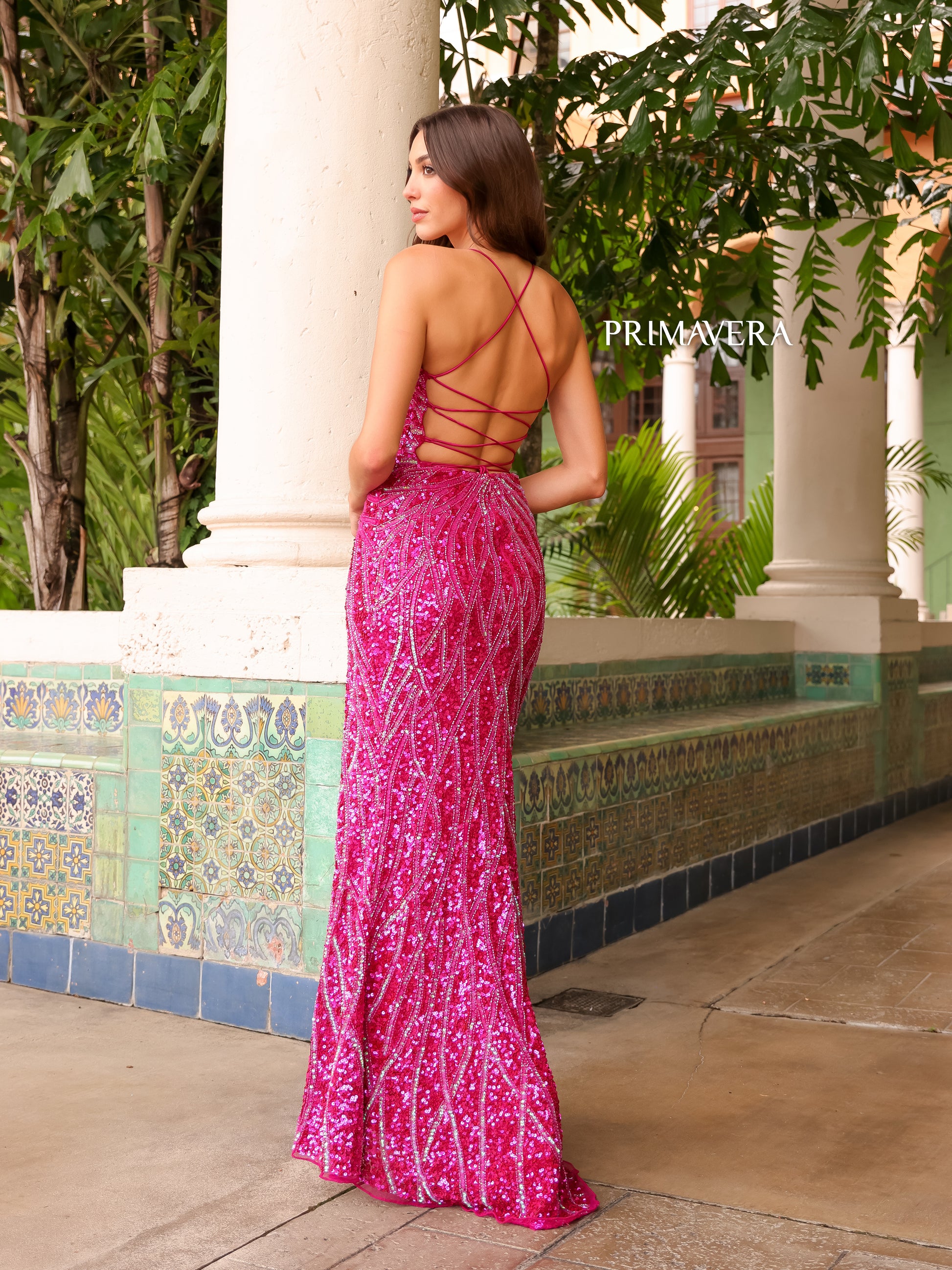 Primavera Couture 3959 Prom Dress Long Beaded Gown. This Gown has a beautiful design all over. Primavera Couture 3959 Sequin Scoop neck Prom Dress Backless Corset Slit Formal Gown  Size-000-18  Colors-Lilac, Coral, Fuchsia, Jade, Peacock, Purple 