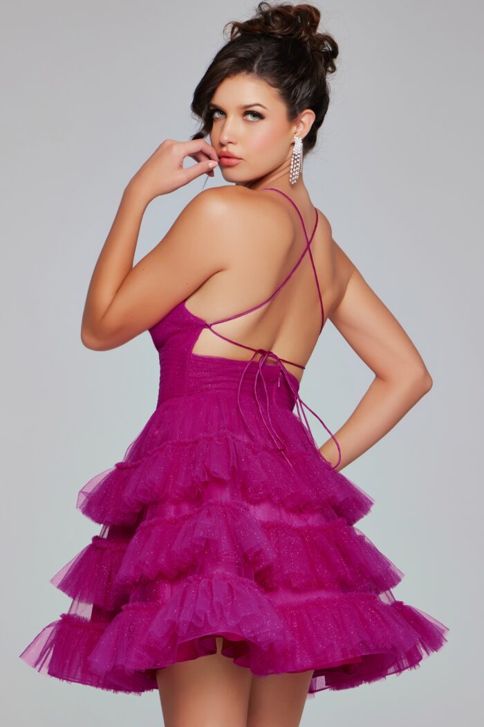 Showcase your style and elegance with the Jovani 39655 Short Layer Tulle Shimmer Homecoming Dress. This stunning dress features a flared silhouette, corset back, and backless design, perfect for any special occasion. Made with high-quality tulle fabric, this dress will shimmer and shine, ensuring you stand out in the crowd.