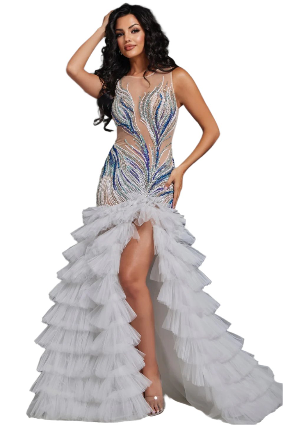 Expertly crafted for pageants, this Jovani 39846 dress boasts a sheer mermaid silhouette, ruffled detailing, and intricate crystal beadwork. With a layered design and a dramatic maxi slit, this formal gown is perfect for making a statement on stage. Shine bright and exude confidence in this show-stopping dress. Make a statement in this captivating gown featuring an illusion neckline that beautifully highlights the intricate beadwork on the bodice. The fitted silhouette through the hips elegantly transitions