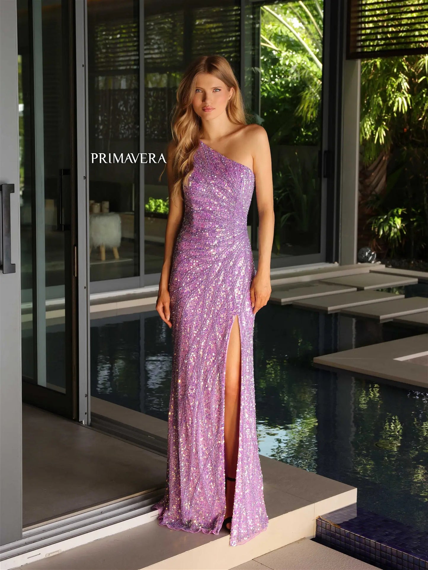 Impress the judges in the Primavera Couture 4133 formal pageant gown. With its asymmetrical neckline and sequin detailing, this dress exudes elegance. The high side slit adds a touch of sophistication, while the back design adds a modern twist. Perfect for making a statement and standing out on stage.