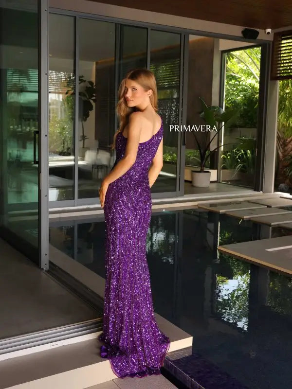 Impress the judges in the Primavera Couture 4133 formal pageant gown. With its asymmetrical neckline and sequin detailing, this dress exudes elegance. The high side slit adds a touch of sophistication, while the back design adds a modern twist. Perfect for making a statement and standing out on stage.